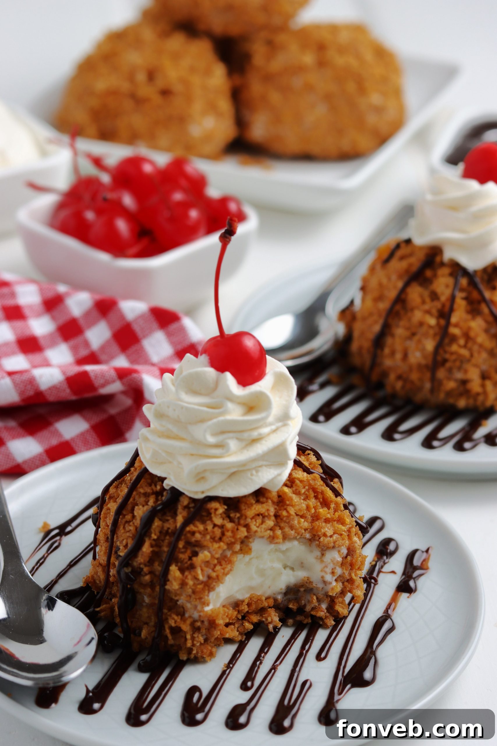 Golden-Fried Ice Cream Delight 6 Fried ice cream served in a bowl, garnished with hot fudge, whipped cream, and a cherry
