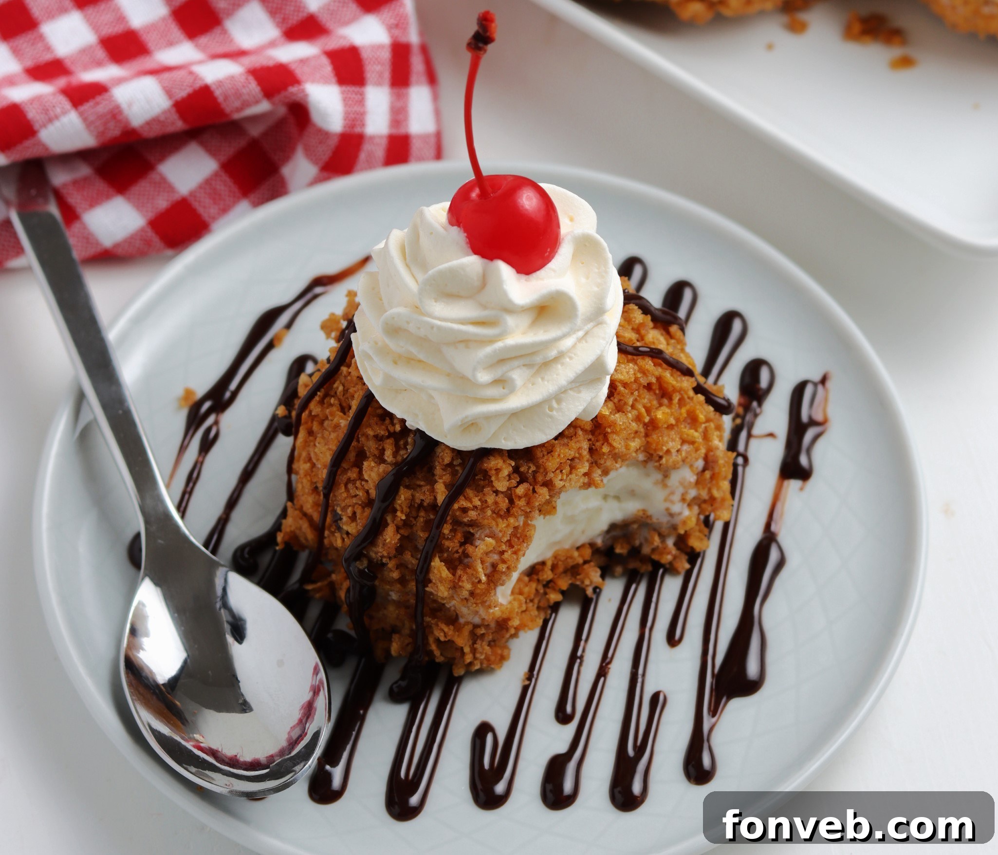 Golden-Fried Ice Cream Delight 7 Another perspective of a fried ice cream ball with various dessert toppings