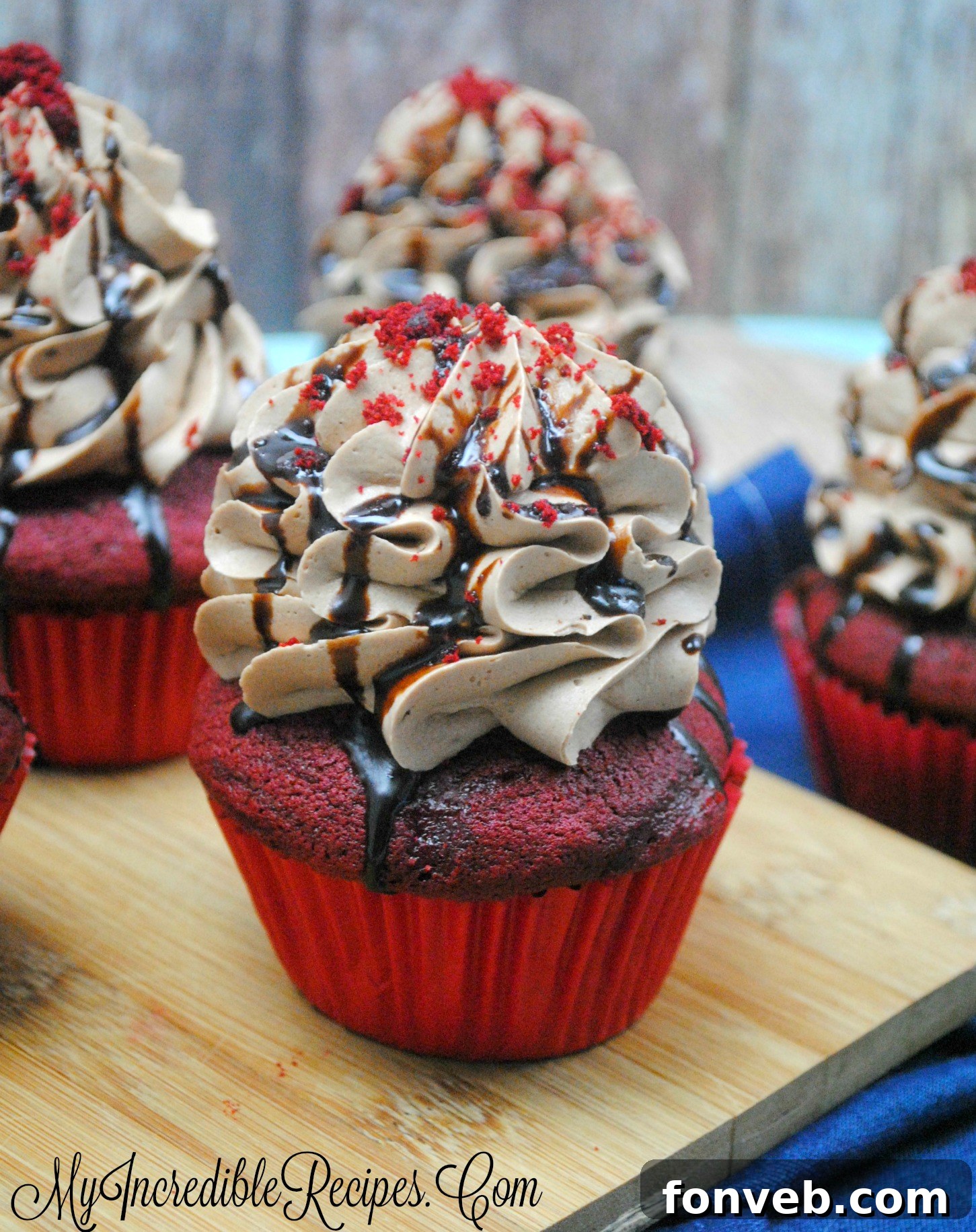 Rich chocolate cream cheese frosting piped onto a Red Velvet cupcake
