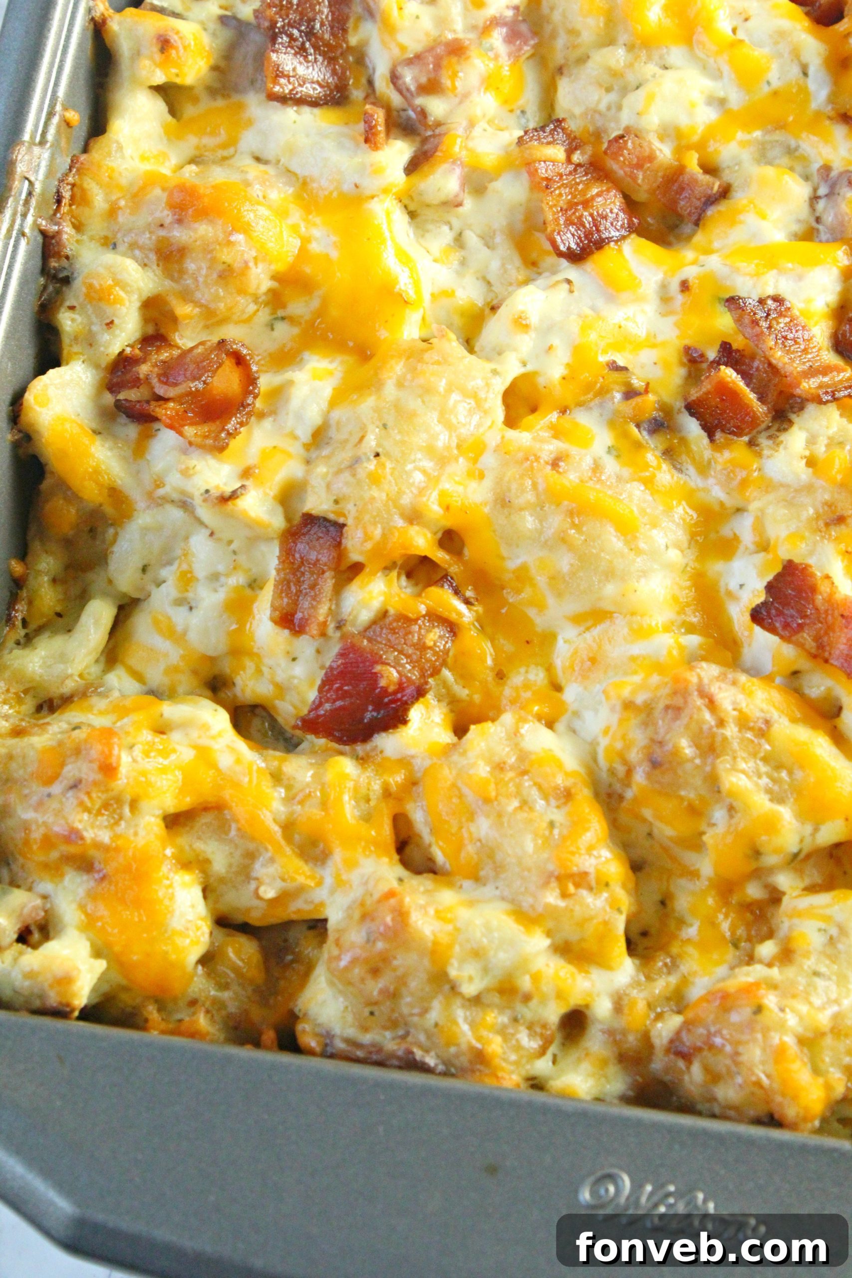 A close-up view of the Cracked Out Chicken Tater Tot Casserole as it bakes to perfection.