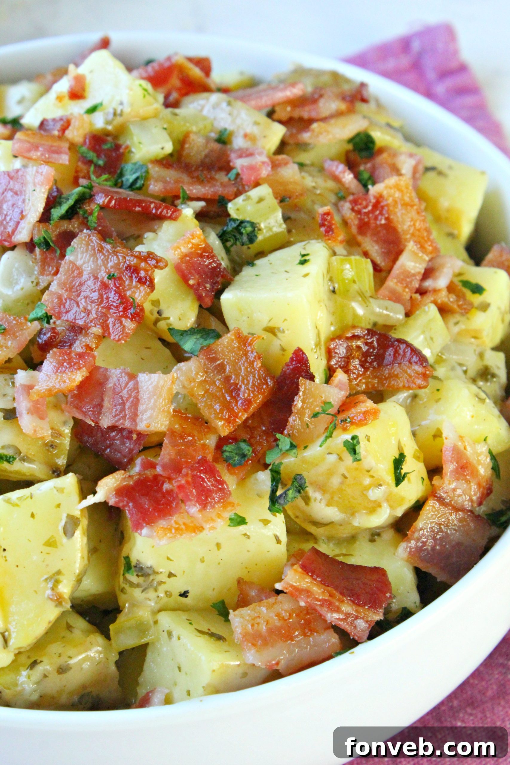 Tangy German Potato Salad 6 Crispy thick-cut bacon strips, a key ingredient for the dressing.