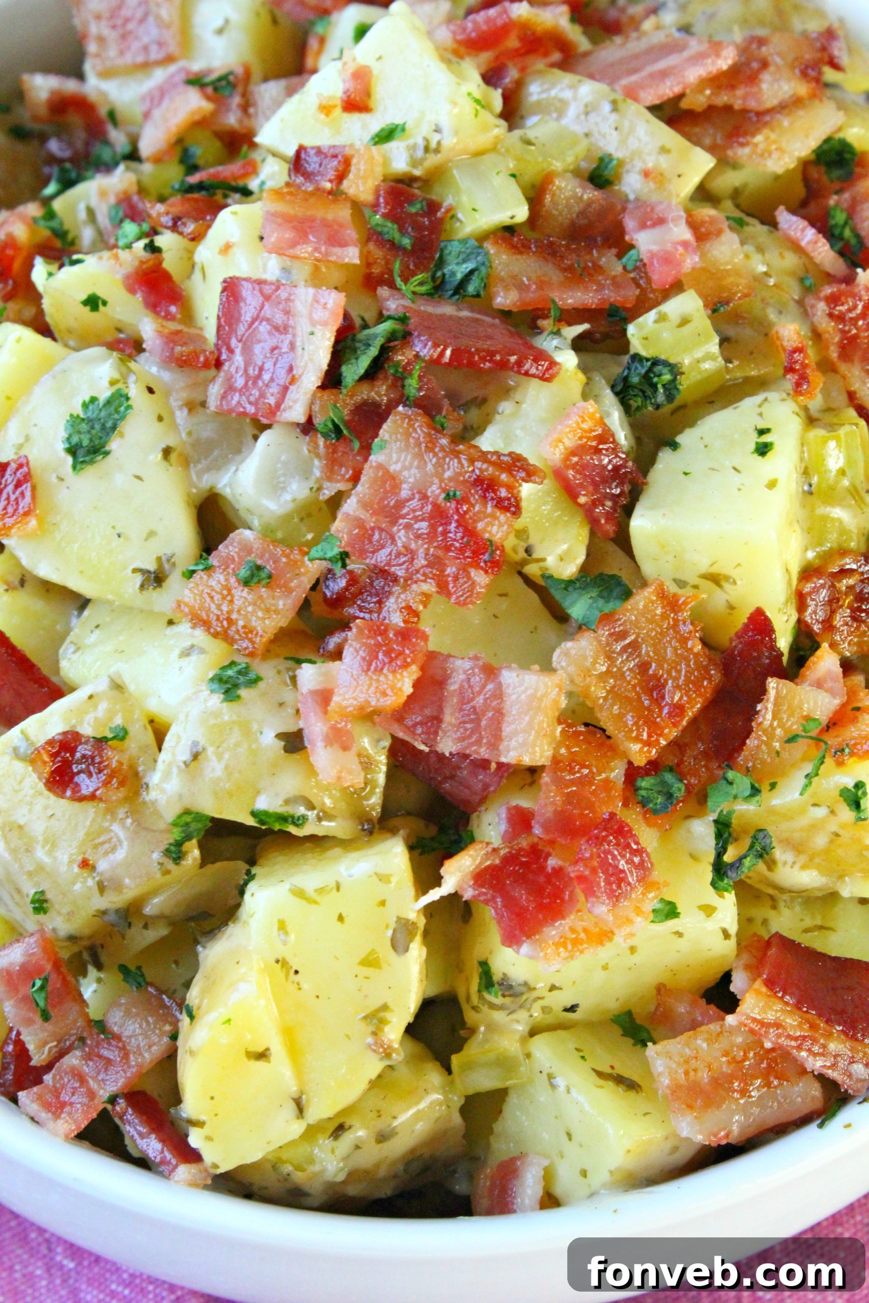 Tangy German Potato Salad 8 A bowl of fresh, vibrant German Potato Salad, highlighting its no-mayo dressing.