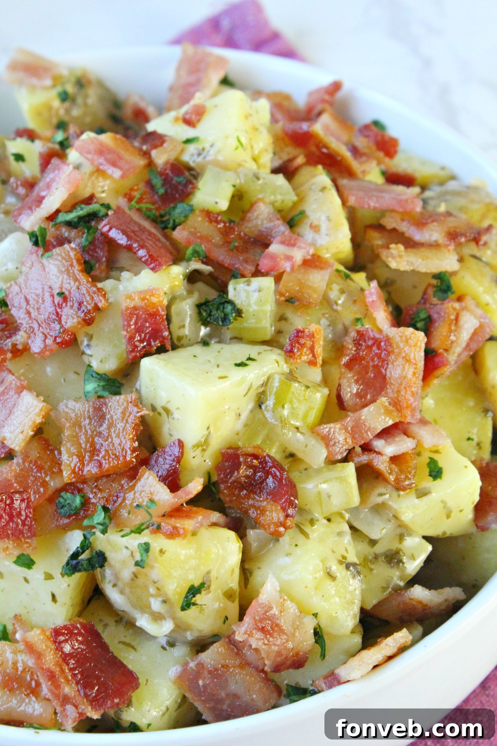 Tangy German Potato Salad 10 A large container of German Potato Salad in a refrigerator, showing proper storage.