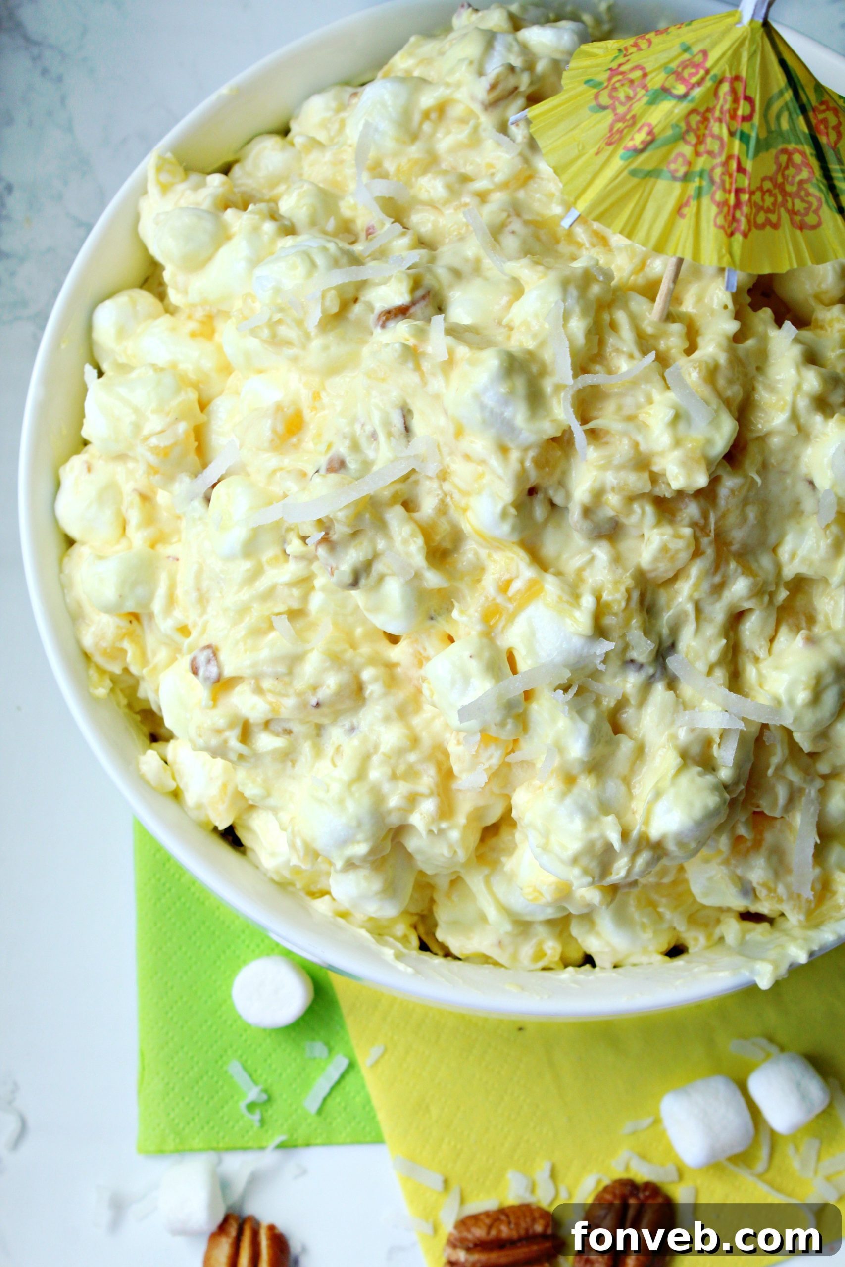 Close-up shot of Piña Colada Fluff in a white bowl, ready to be served.