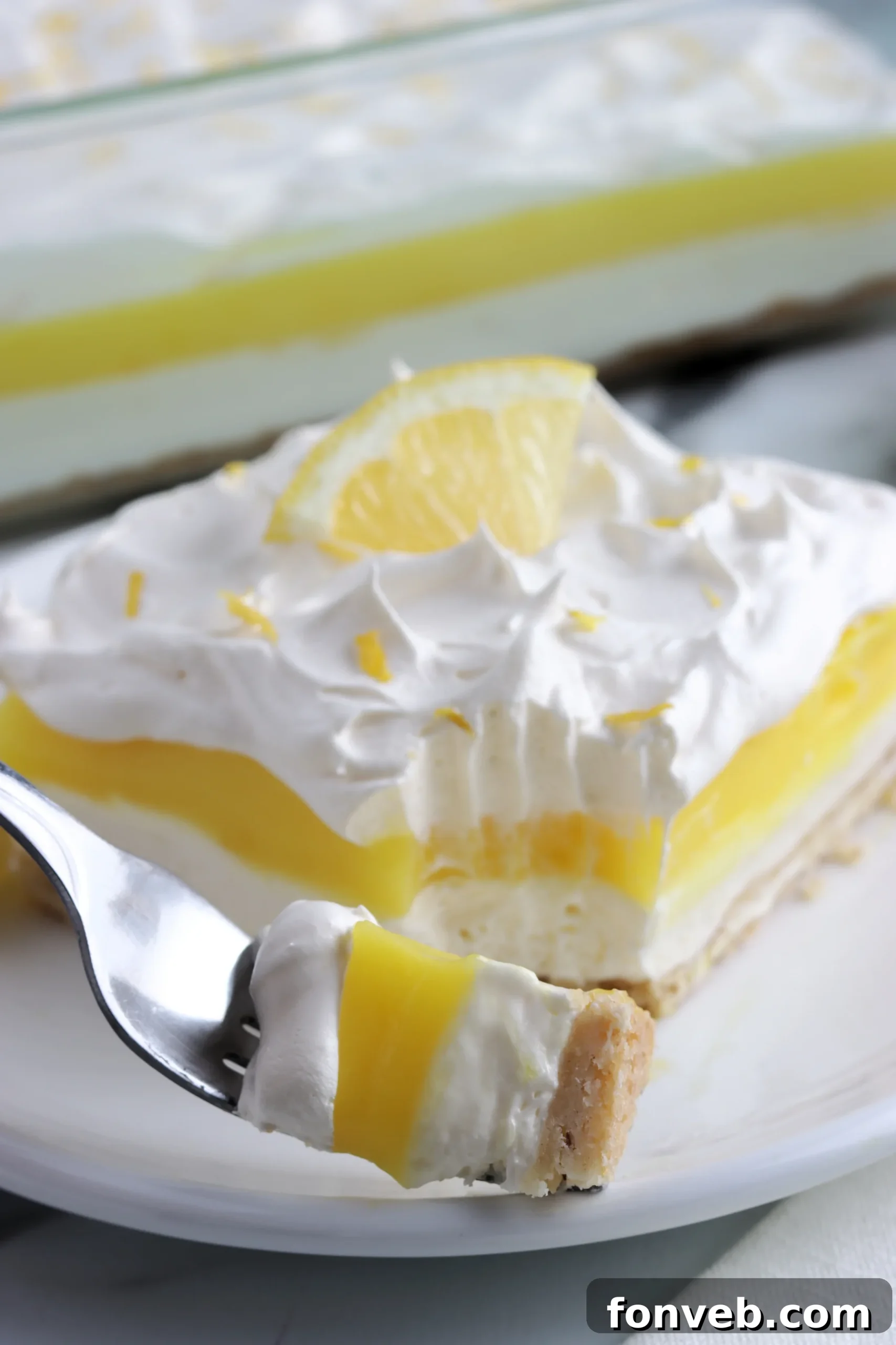 Lemon Lush Dessert layers on a serving plate