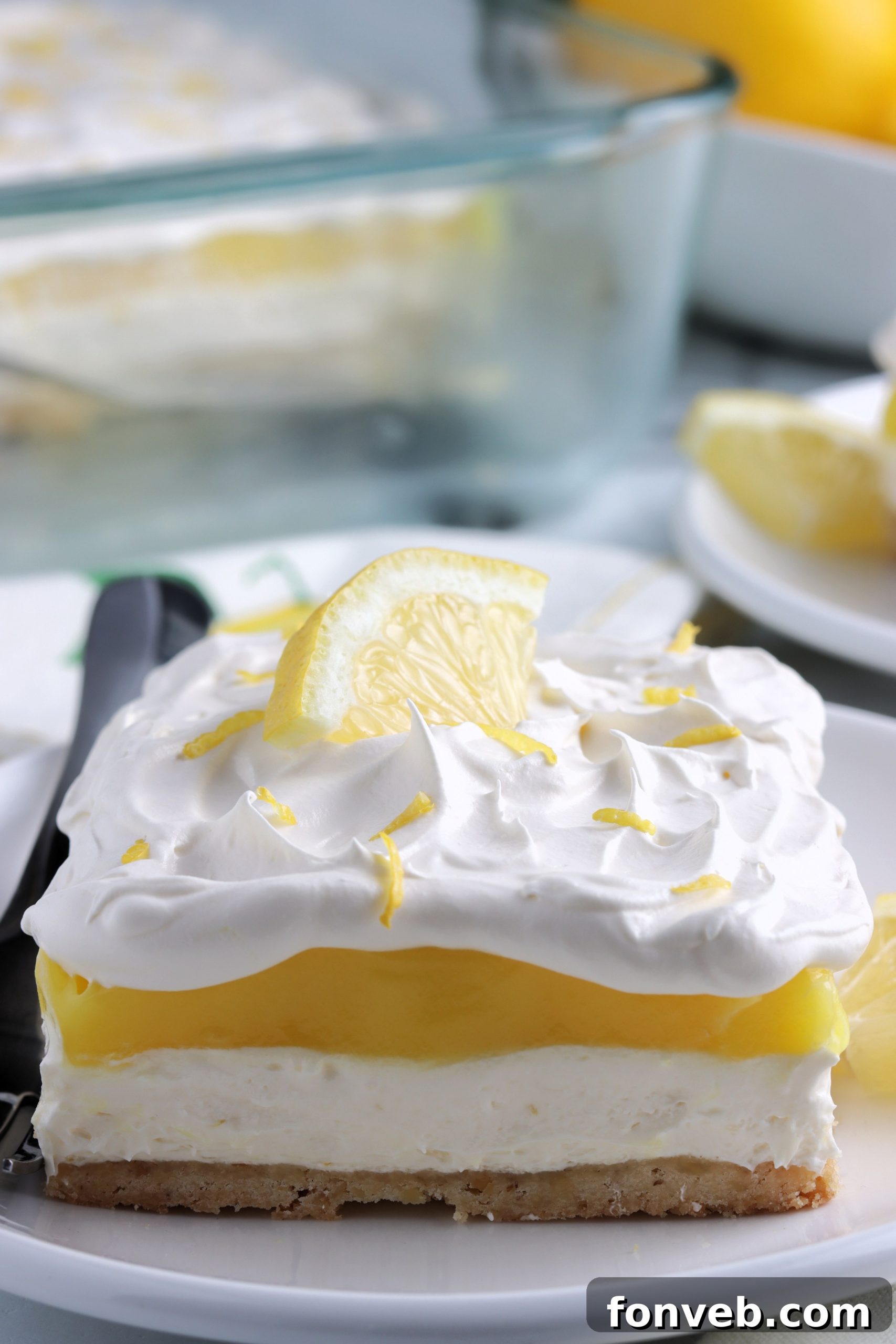 A slice of Lemon Lush Dessert on a small plate