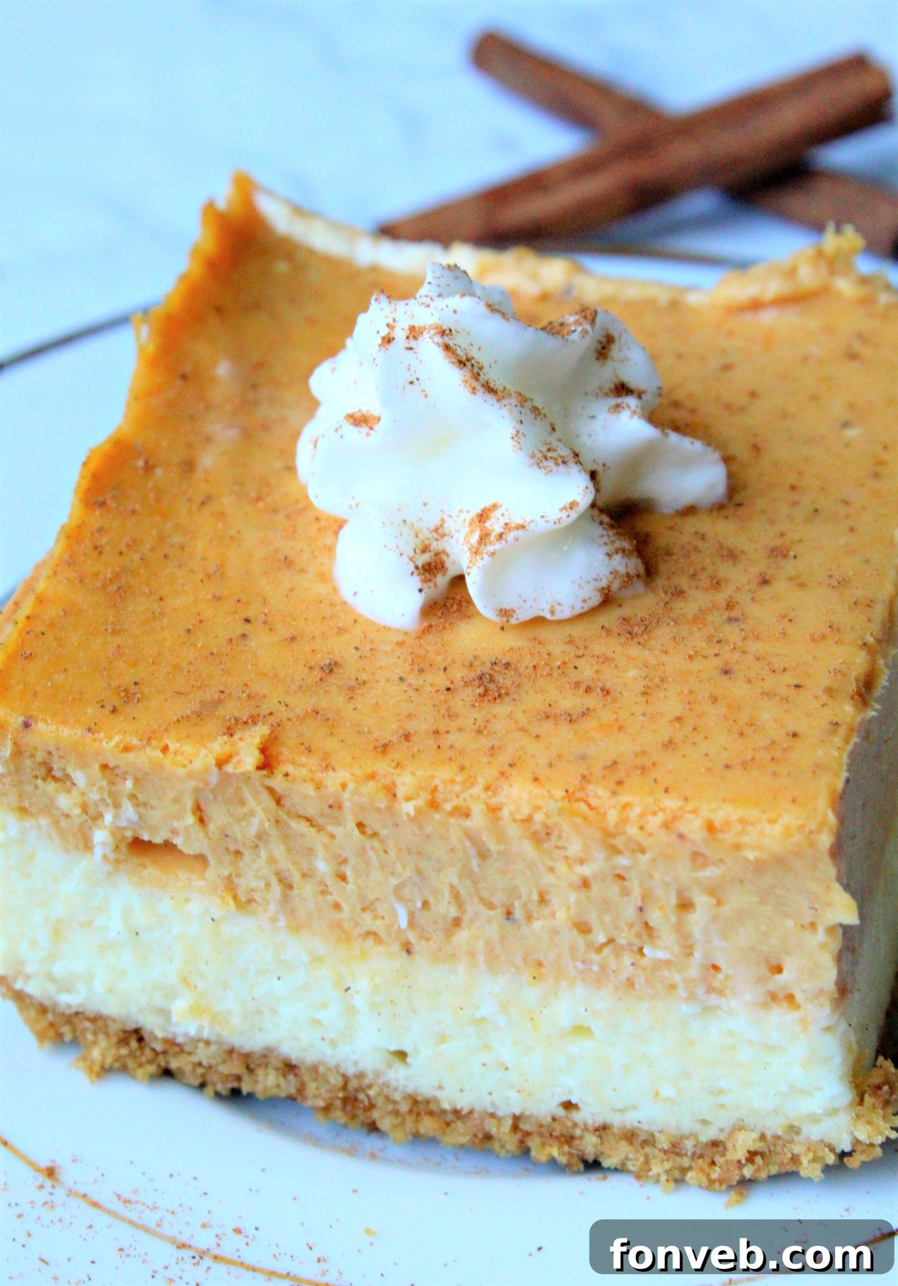 Cleanly sliced Pumpkin Cheesecake Bars presented on a festive platter