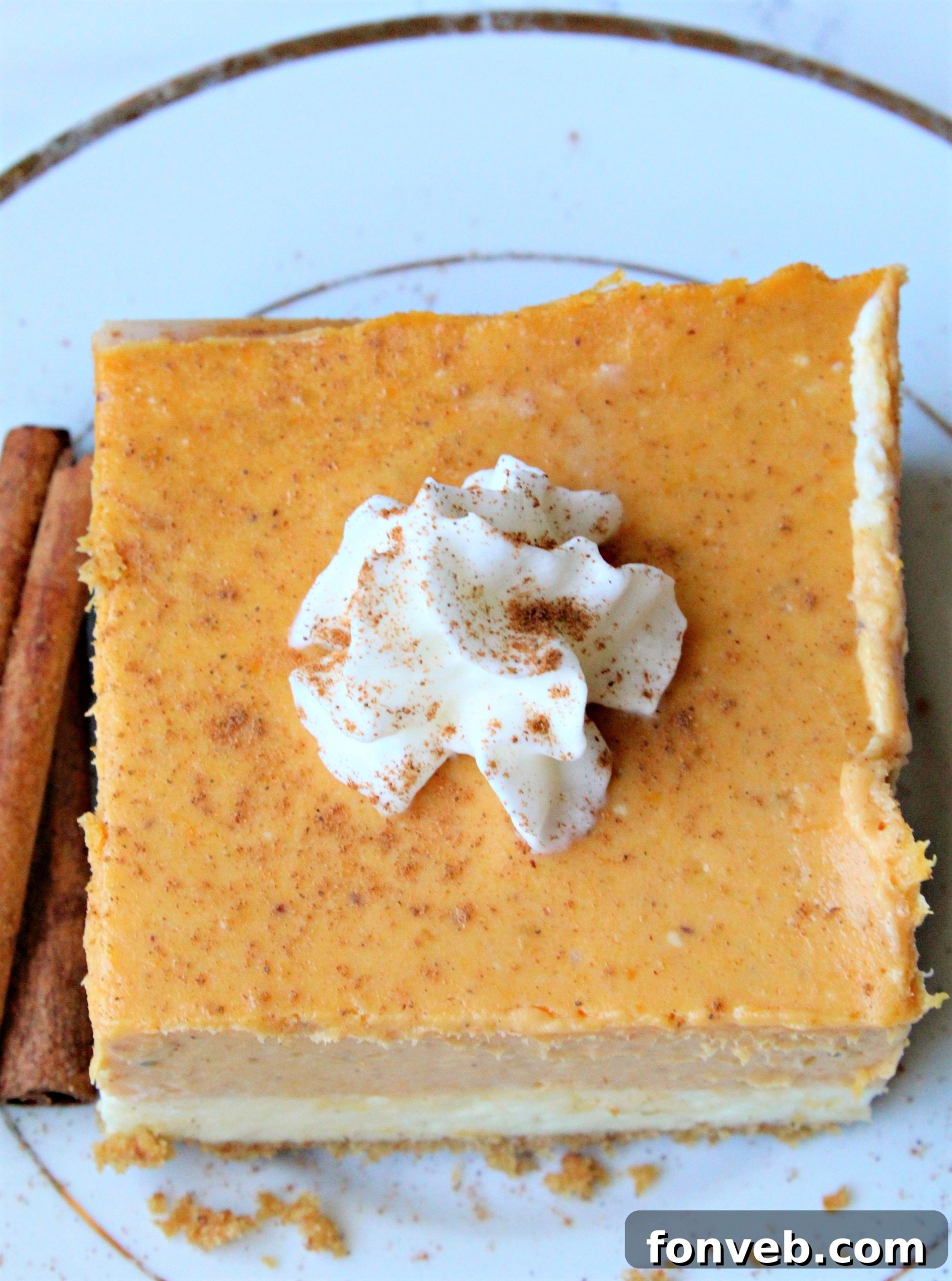 Pumpkin Cheesecake Bars neatly stored in an airtight container for lasting freshness