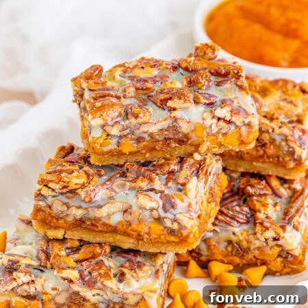 Close-up of a single Pumpkin Pecan Magic Bar, showcasing its layers and delicious texture.