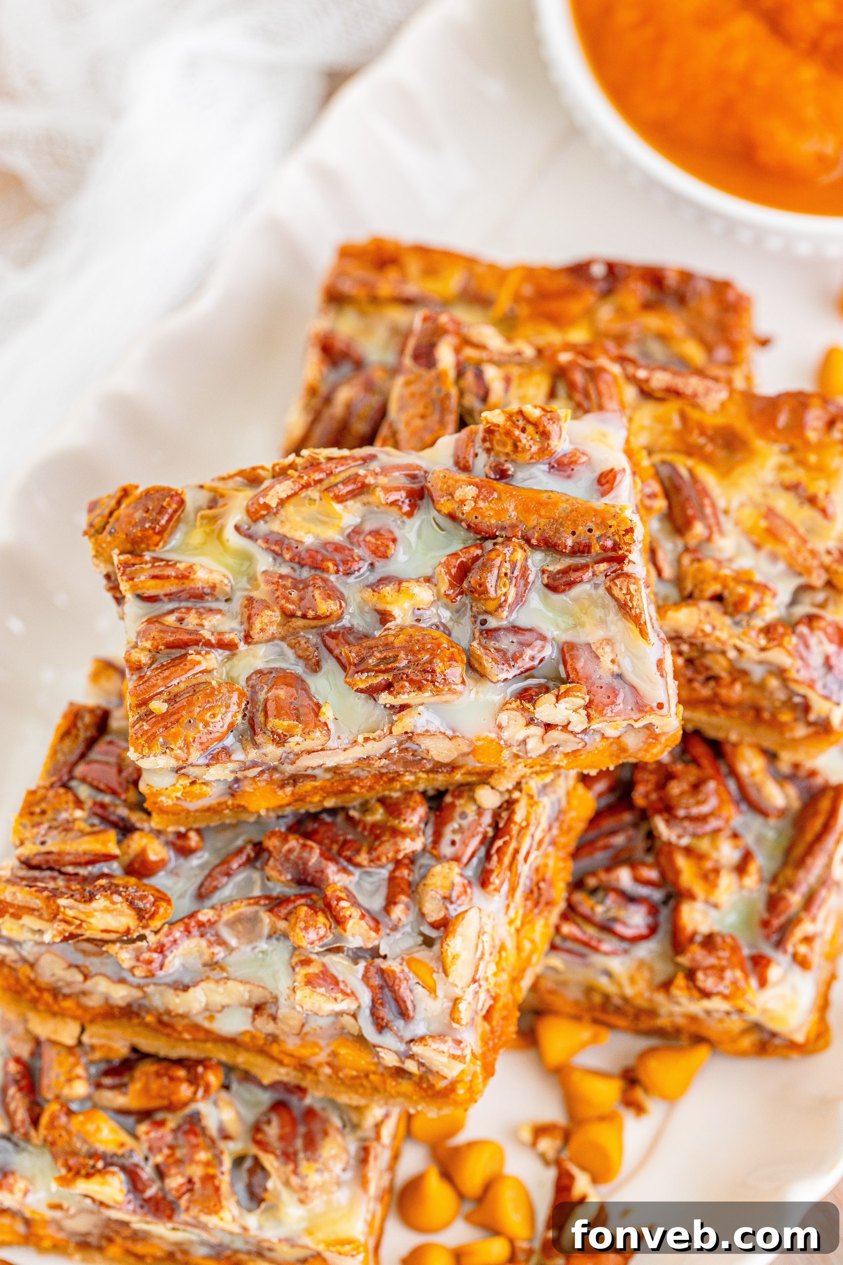 A meticulously cut tray of Pumpkin Pecan Magic Bars, each square perfectly formed and ready to be devoured, highlighting their adaptability for customization.