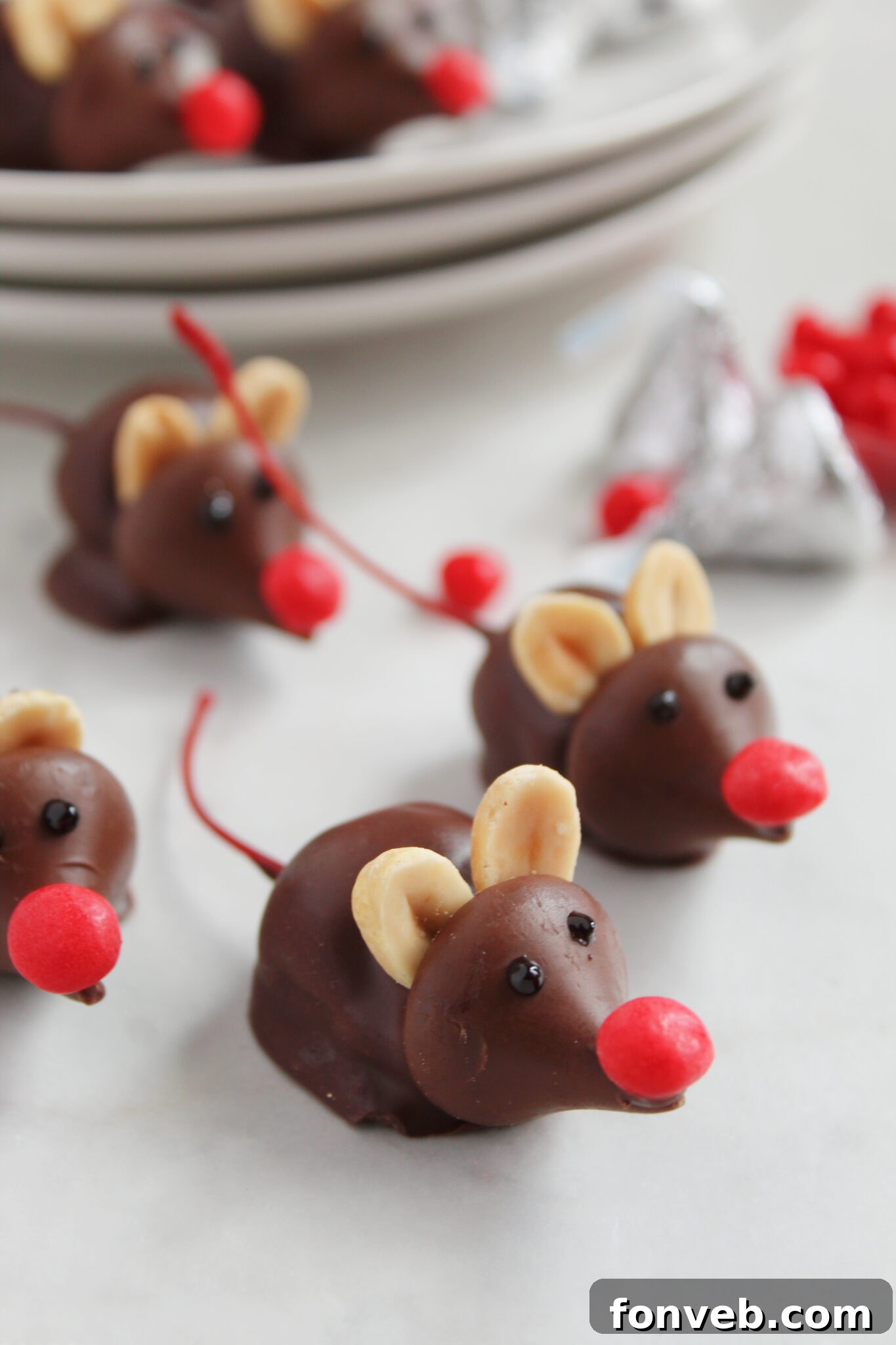 Hershey's Whimsical Winter Mice 6 Mice candy with red noses and cherry stem tails displayed artistically