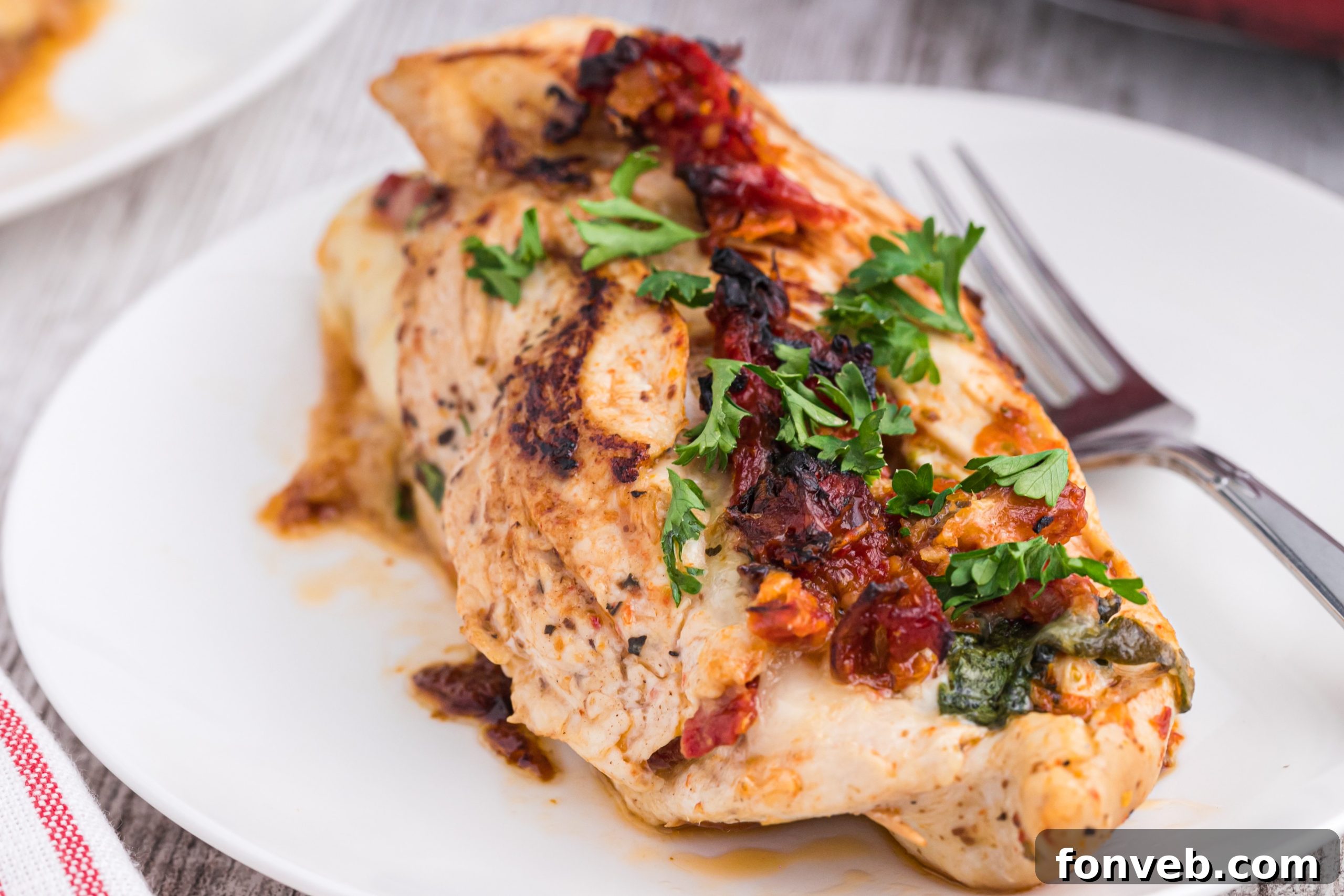 Close-up of the molten cheese and spinach filling inside the chicken