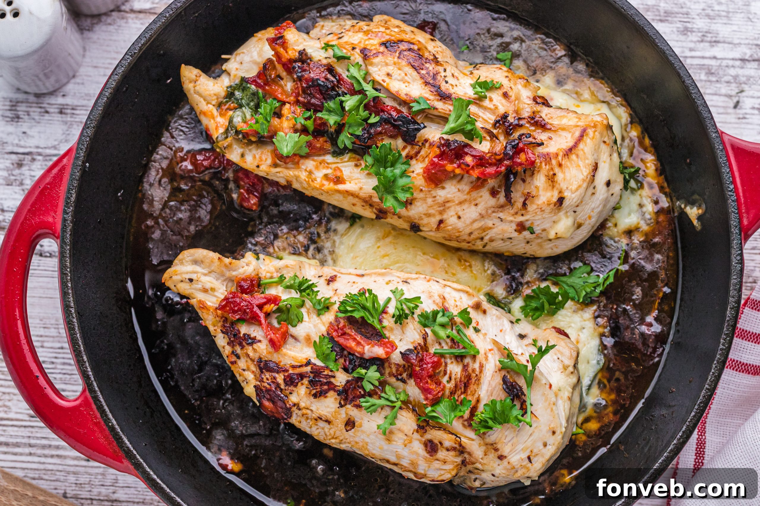 A stuffed chicken breast being prepared, showing the delicious filling
