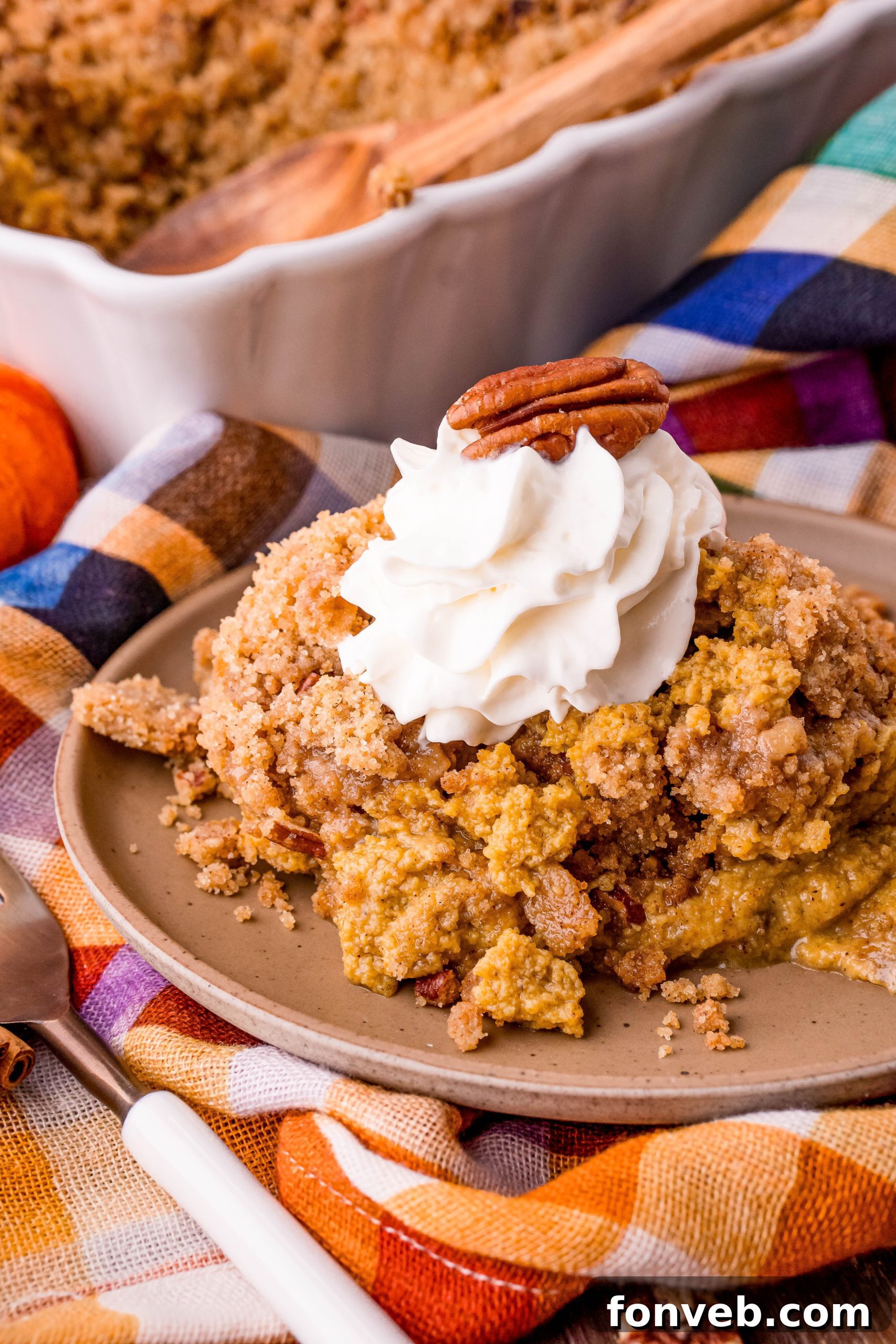 Overhead view of pumpkin crisp in a baking dish, ready to be served