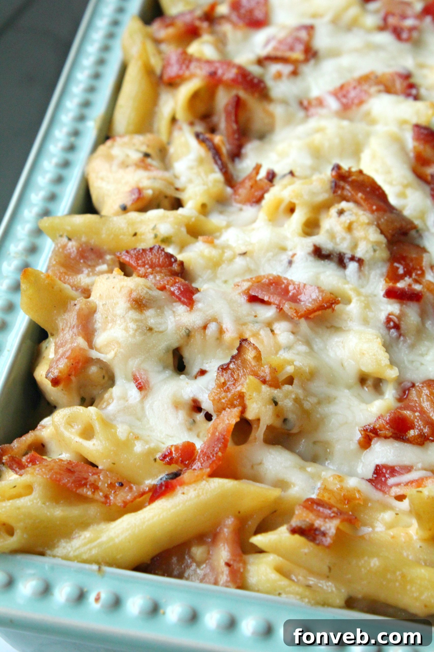 A bowl of creamy, cheesy sauce, ready to be combined with the chicken and pasta.