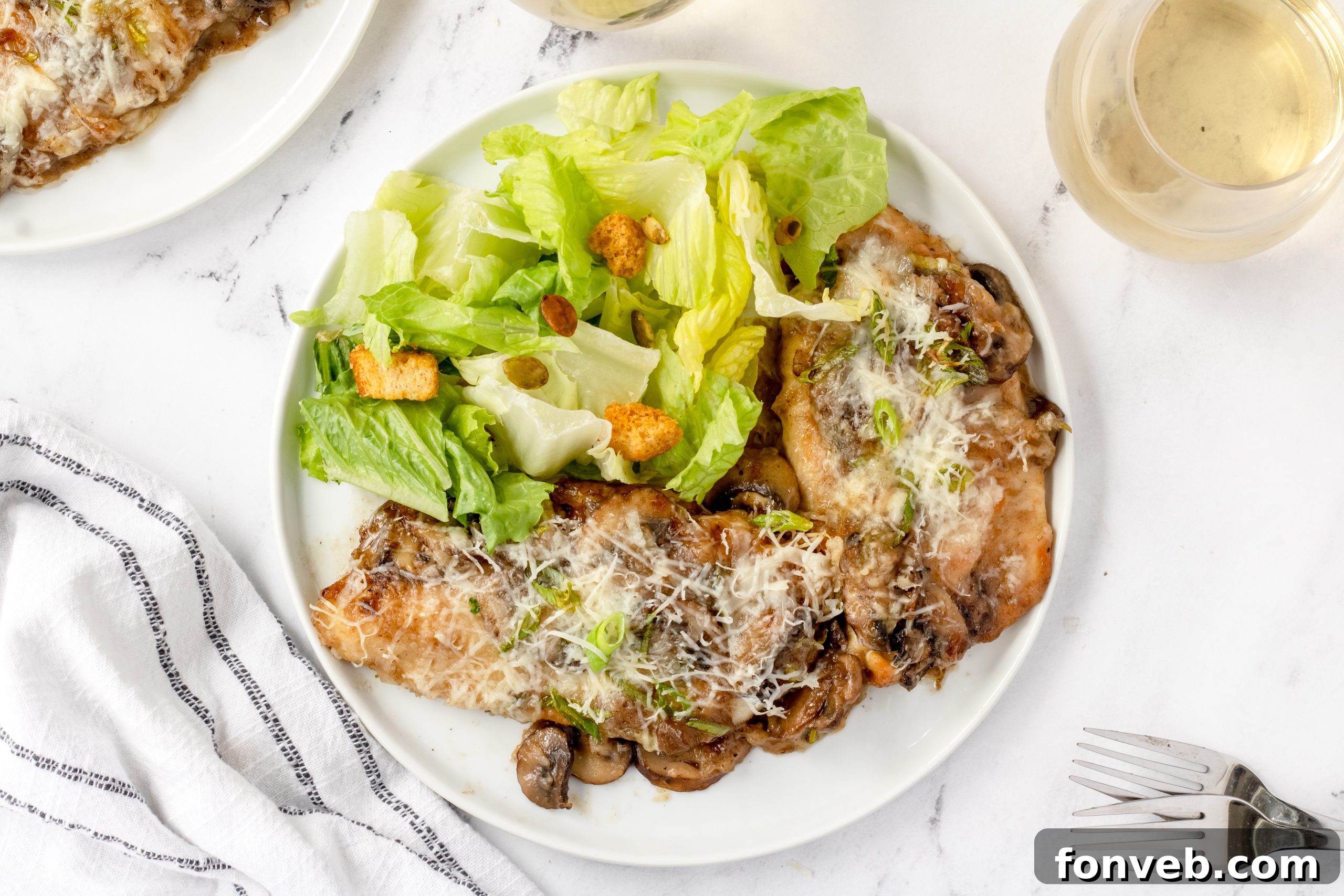 Finished Chicken Lombardy plated with a side of pasta