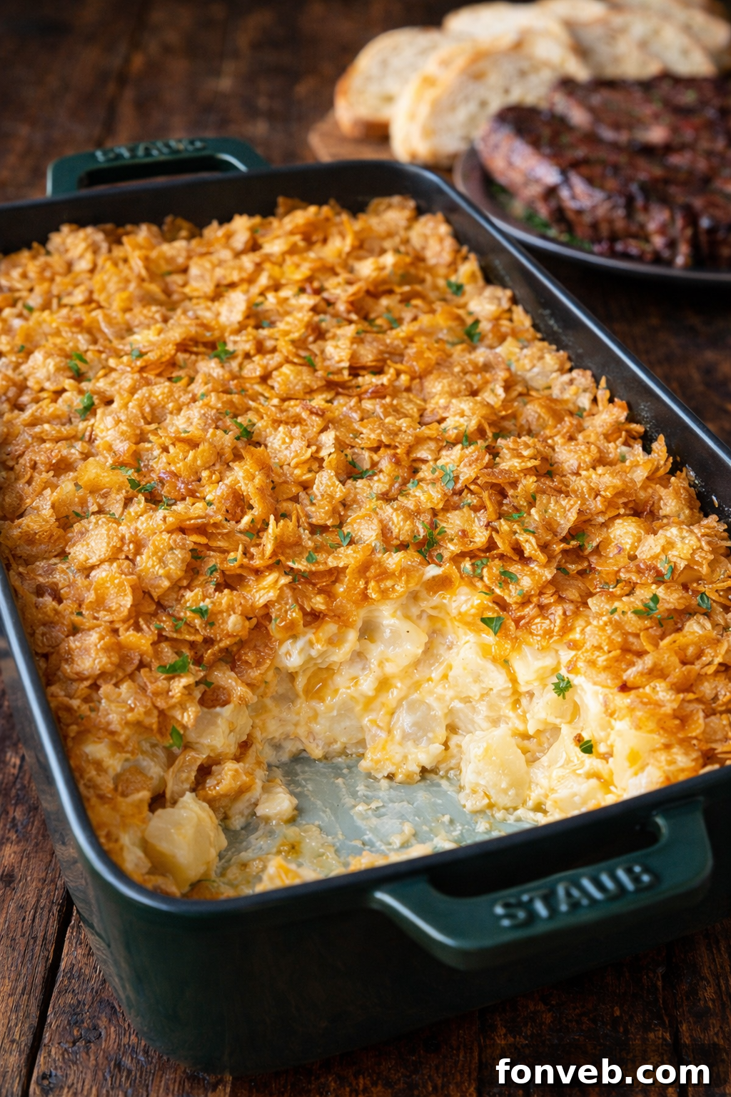 Golden brown Funeral Potatoes in a baking pan, ready to be served
