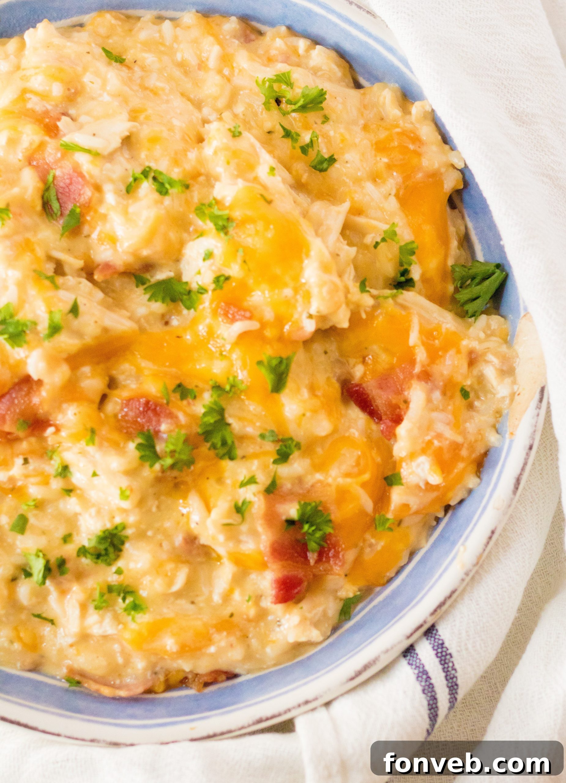 A family-sized serving of Slow Cooker Cheesy Crack Chicken and Rice, highlighting its comforting appeal.