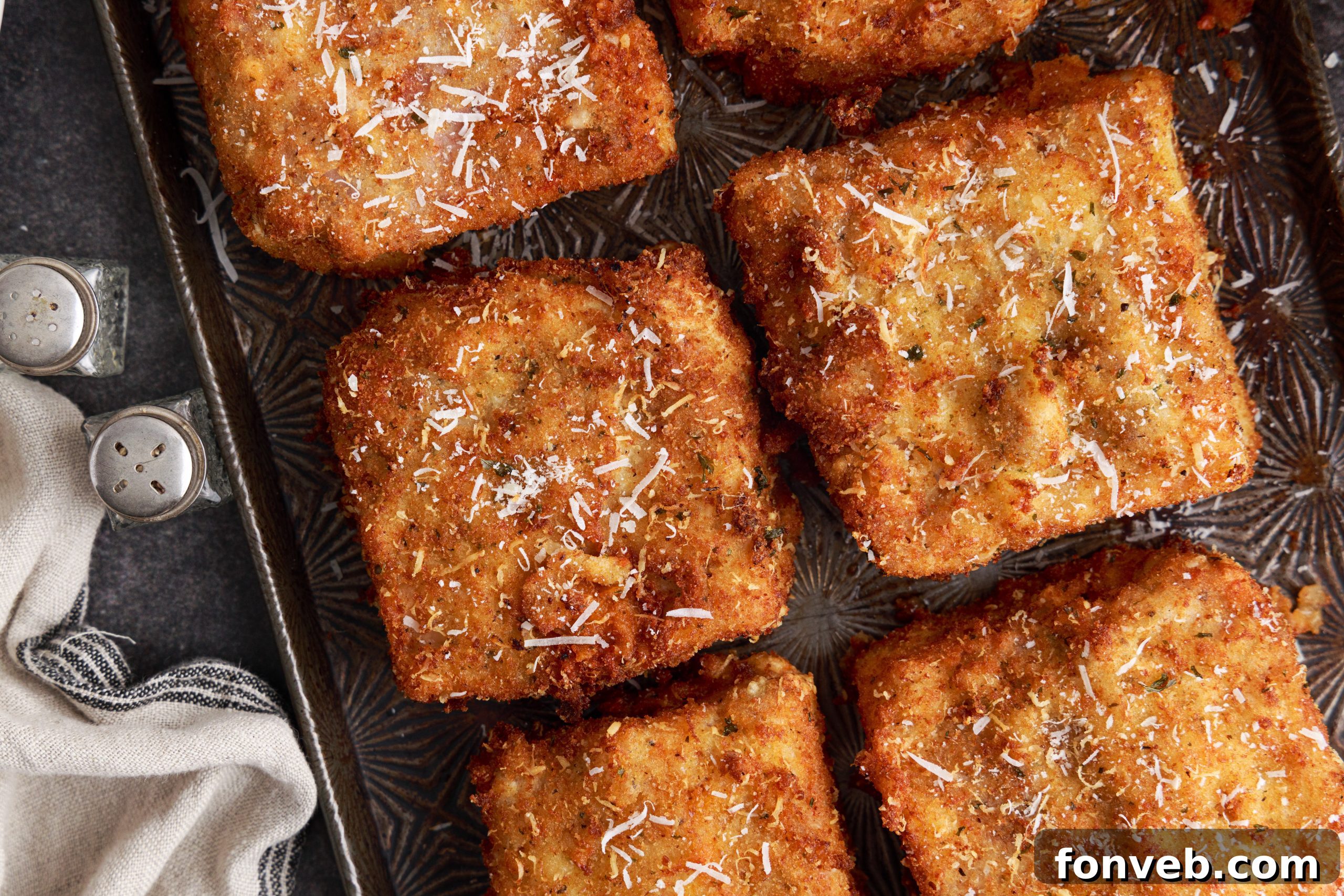 Golden Lasagna Crunch 5 Lasagna squares coated in breadcrumbs, ready for frying