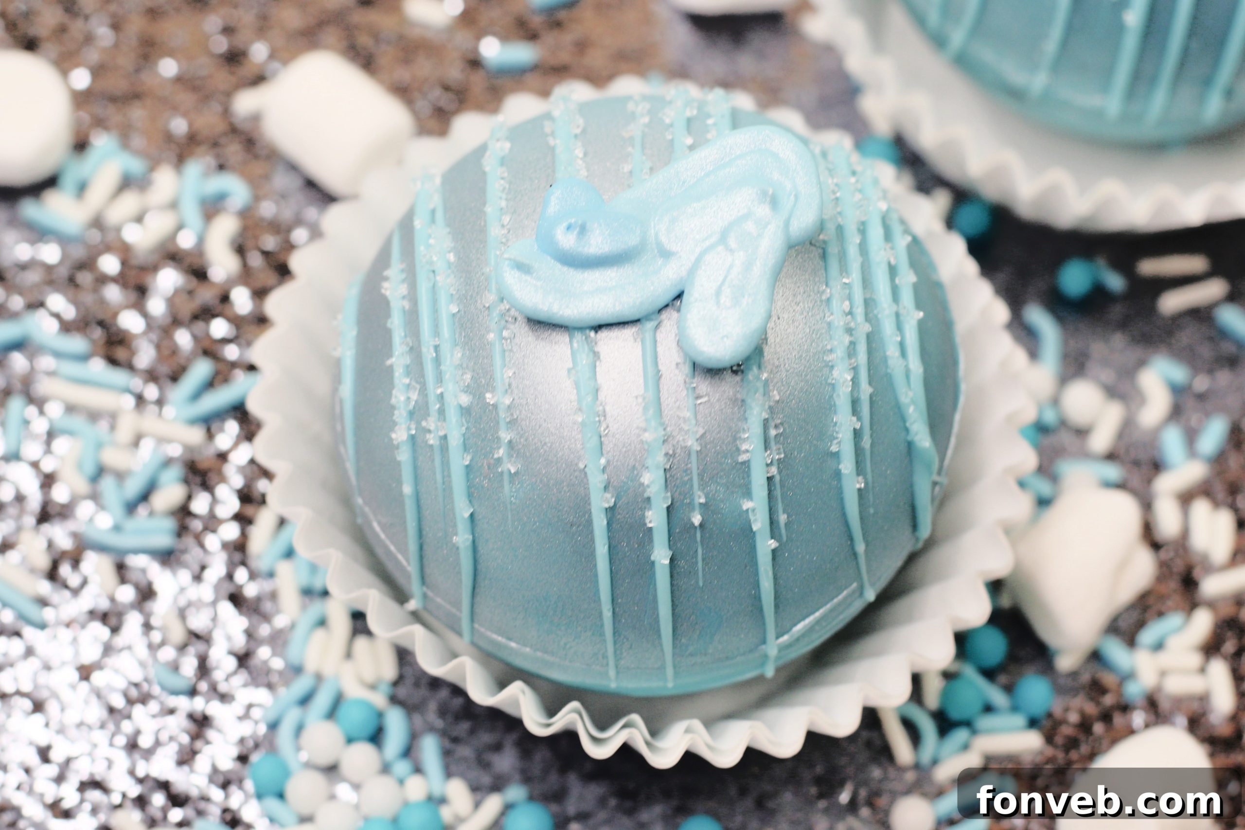 Cinderella Hot Cocoa Bombs melting in a mug, revealing marshmallows