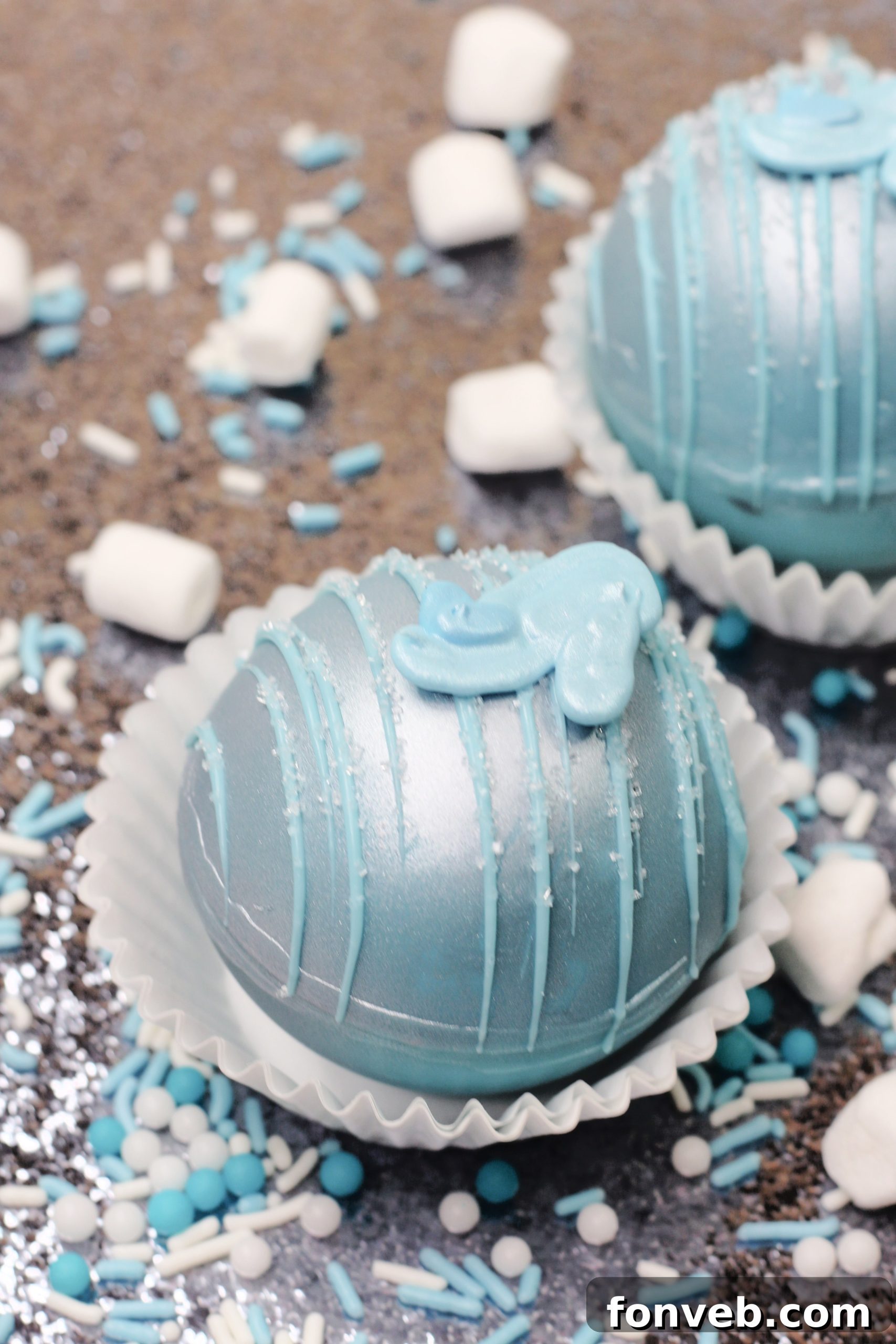 Hand pouring hot milk over a Cinderella Hot Cocoa Bomb