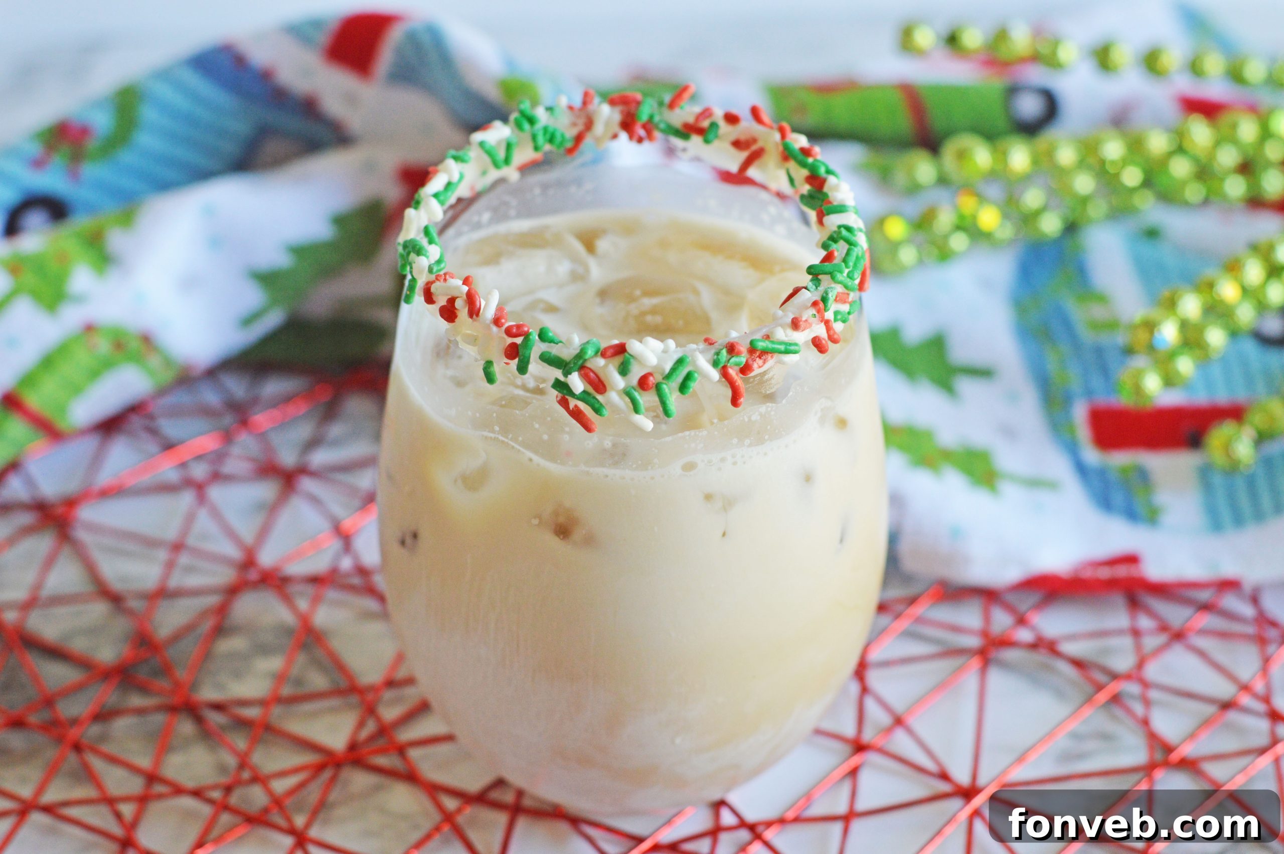 Close-up of a festive Christmas Cookie Cocktail garnished with sprinkles.