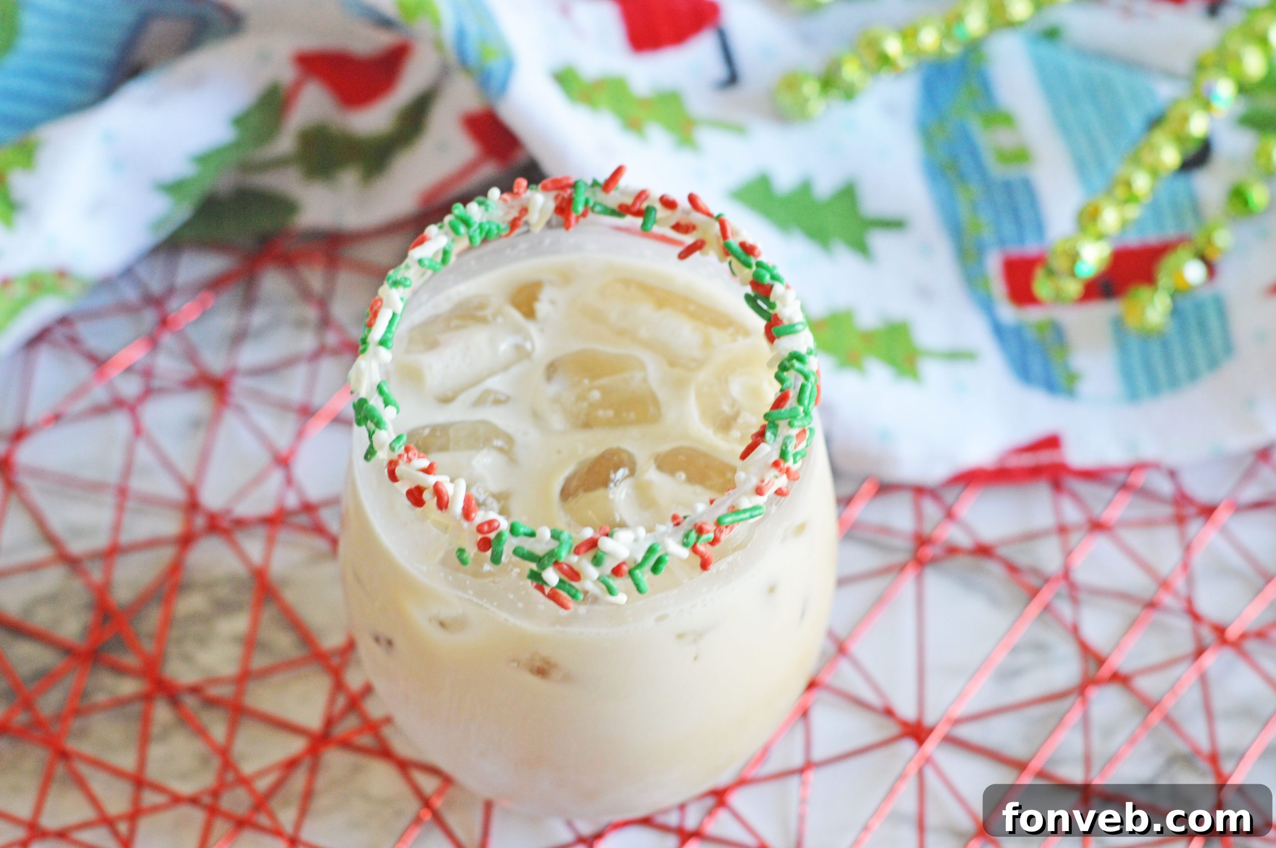 Two festive Christmas Cookie Cocktails, one with a cookie garnish.