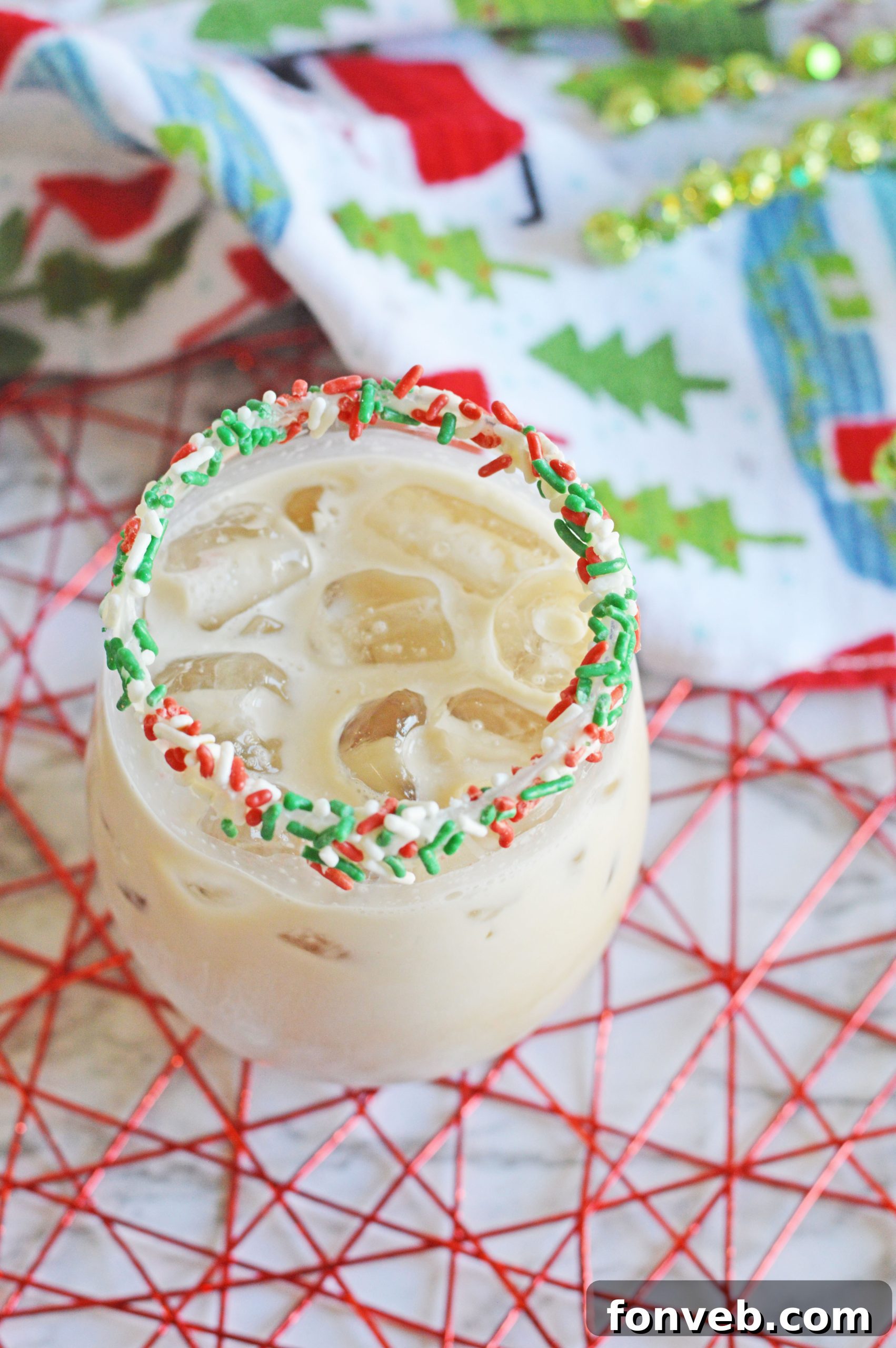 Elegant glass of Christmas Cookie Cocktail on a festive table setting.