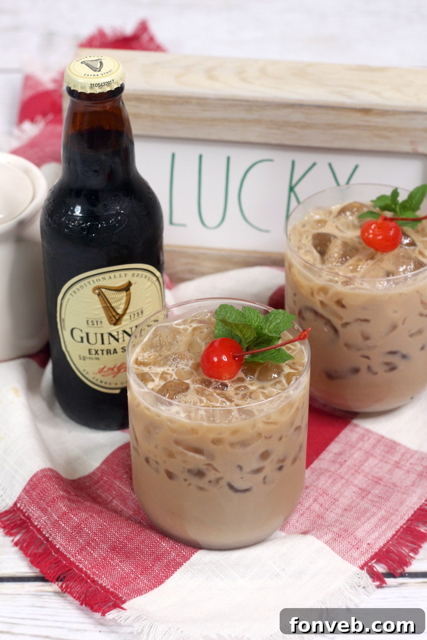 A festive Baileys Irish Cream Cocktail surrounded by cozy holiday decor, perfect for winter evenings.
