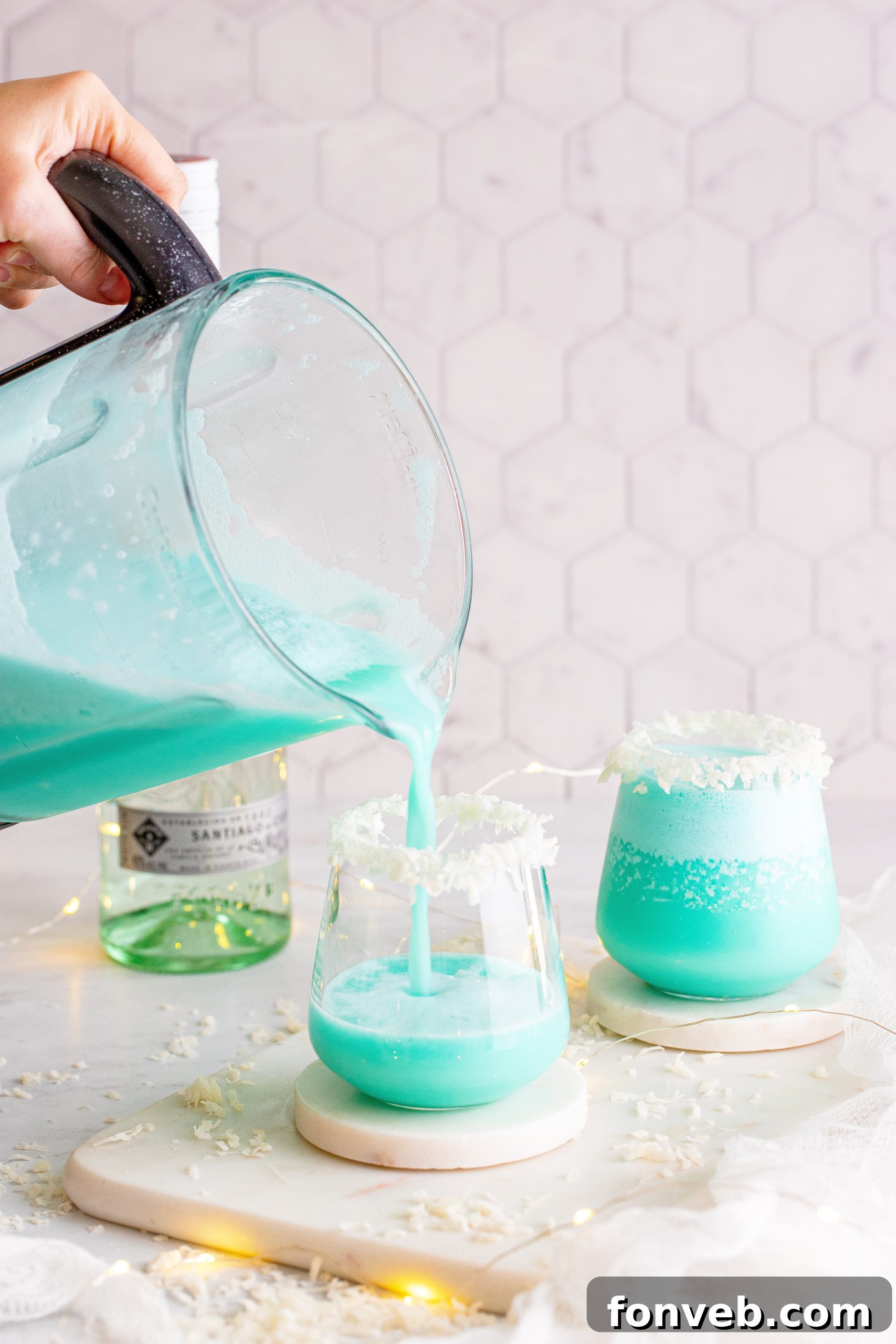 A Jack Frost Cocktail with a perfectly frosted rim, highlighting the vibrant blue liquid and inviting presentation.