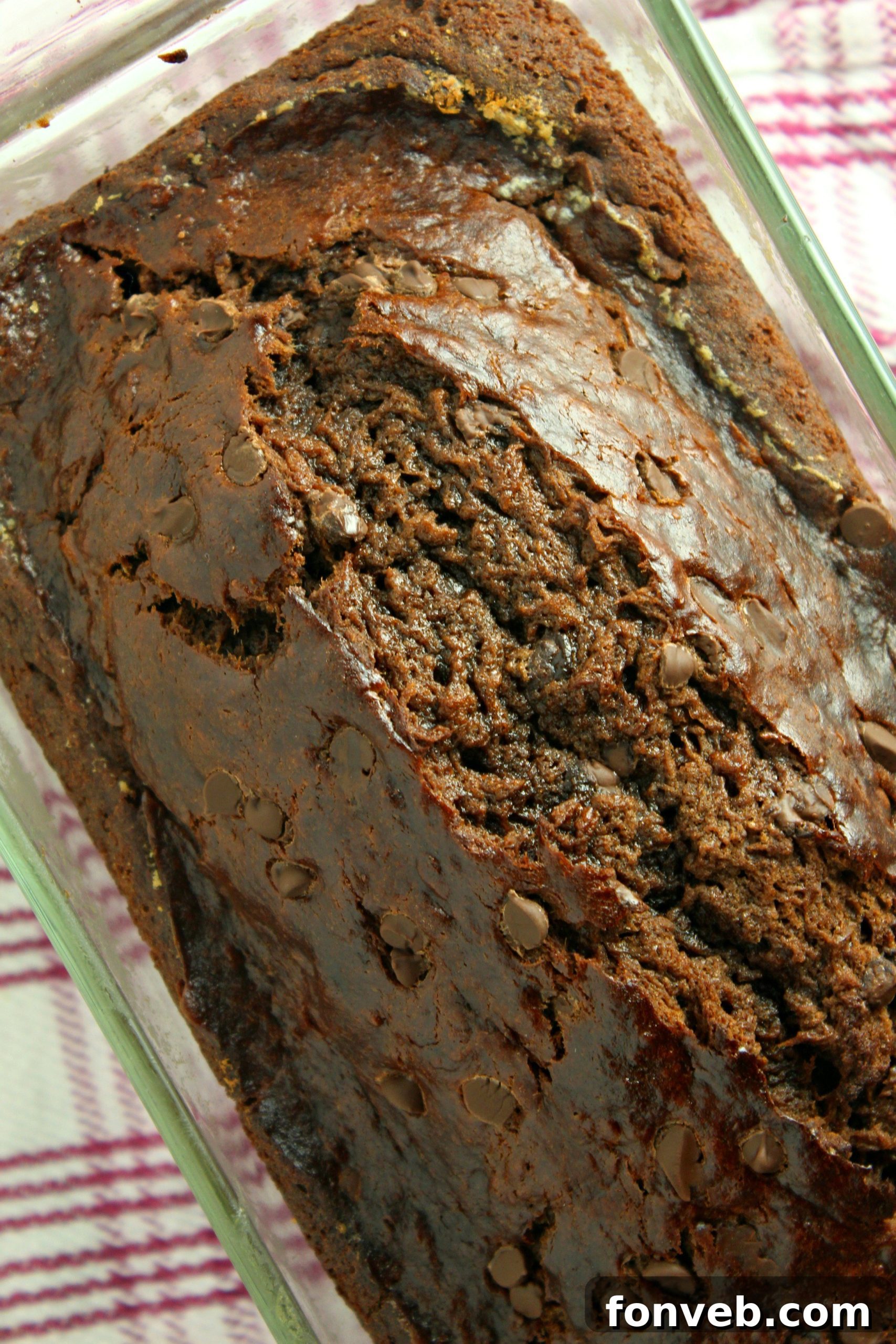 Two loaves of freshly baked Double Chocolate Banana Bread on a cooling rack