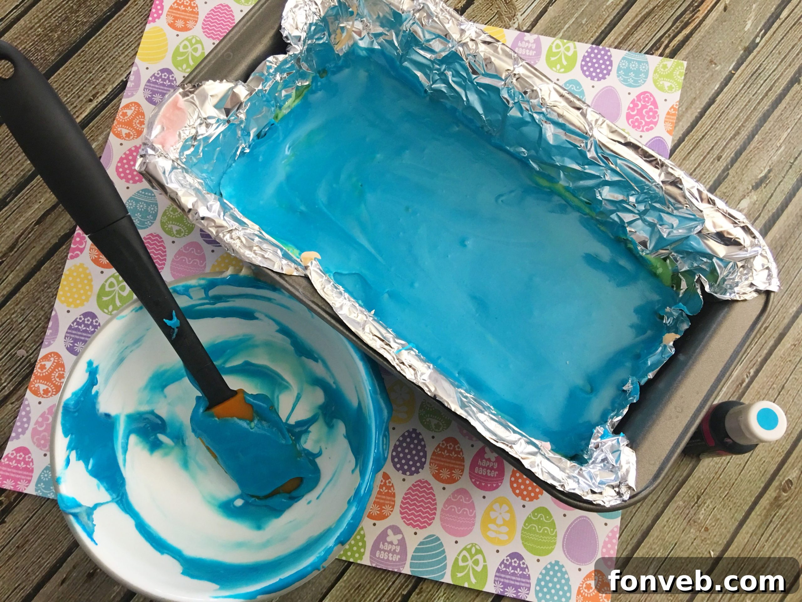 A close-up shot of several neatly cut Unicorn Fudge squares, stacked on a serving plate, highlighting their perfect shape and vivid colors.