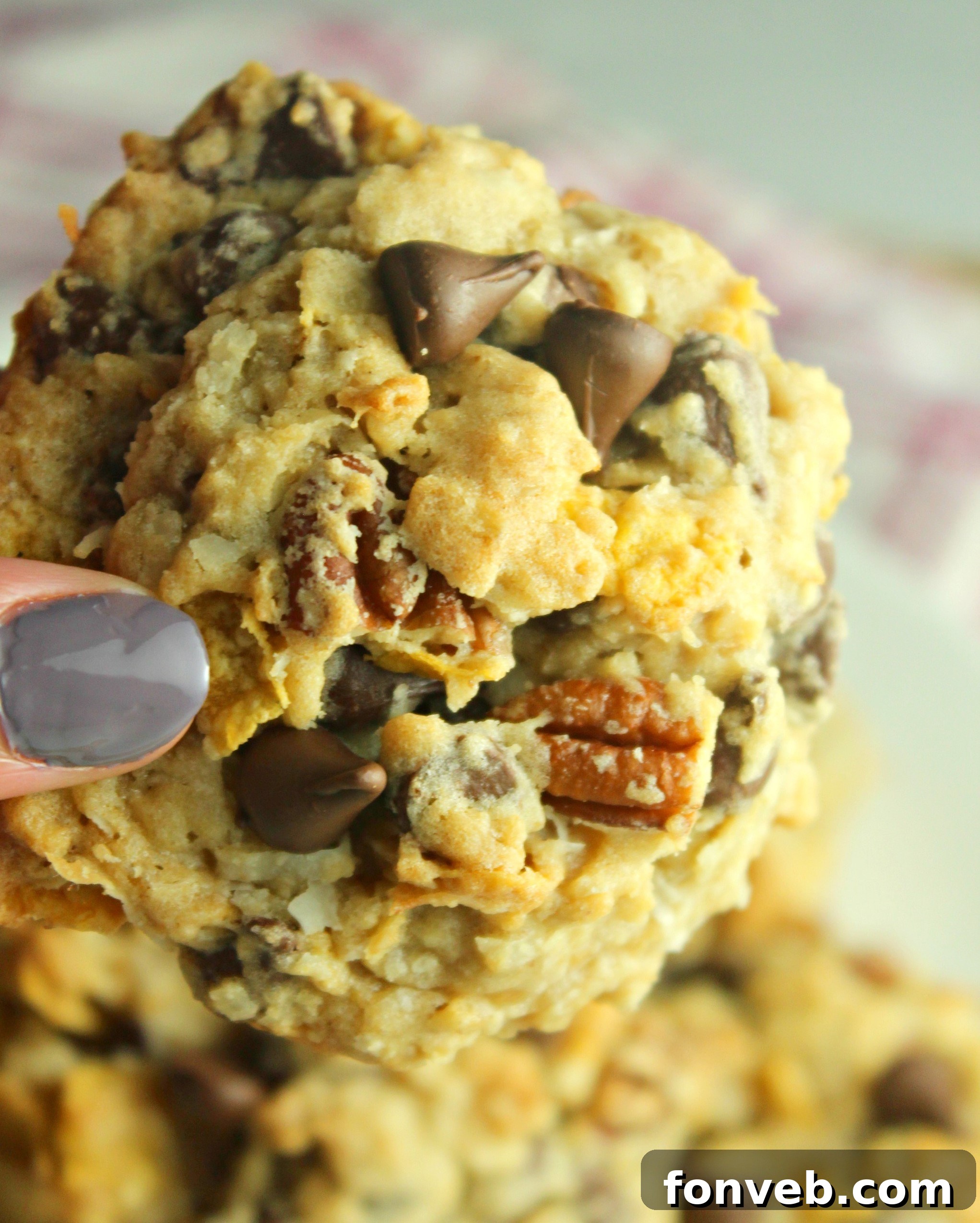 Overhead shot of freshly baked Cowboy Cookies arranged symmetrically on a baking sheet, cooling down.