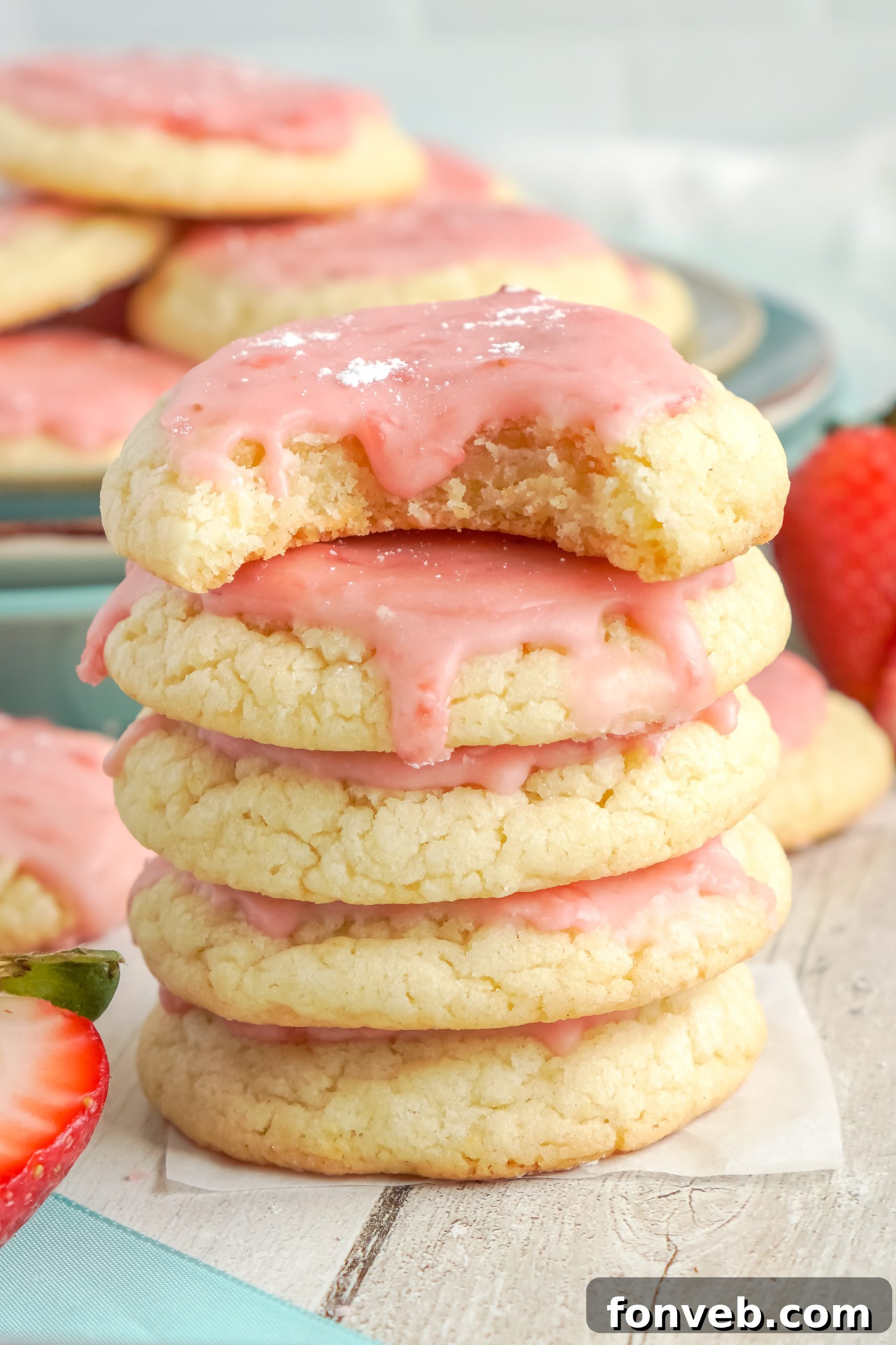 Freshly baked sugar cookies with a delicate strawberry glaze, arranged beautifully on a cooling rack.