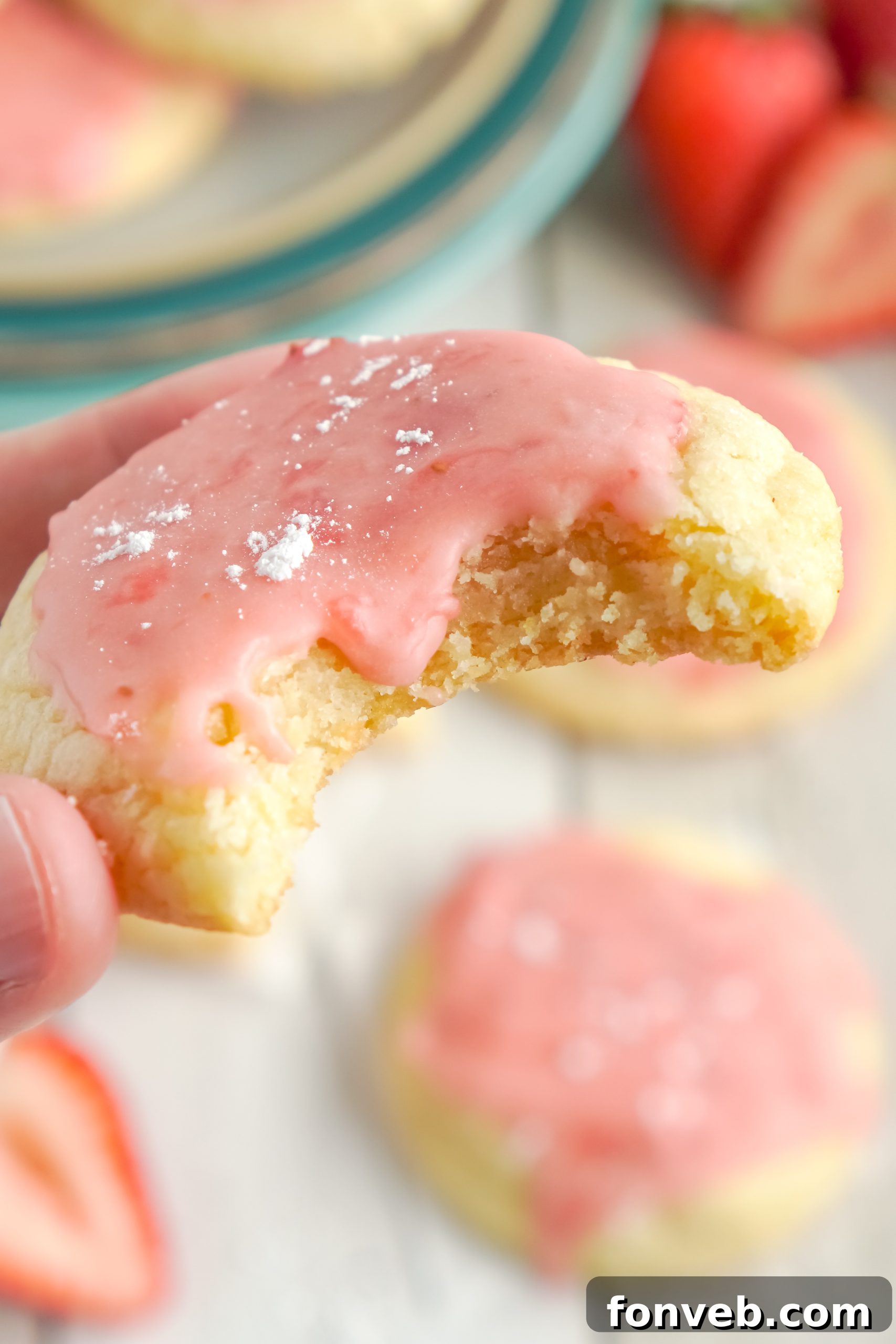 A selection of sugar cookies, some with strawberry glaze, others with potential alternative glazes or toppings, highlighting versatility.