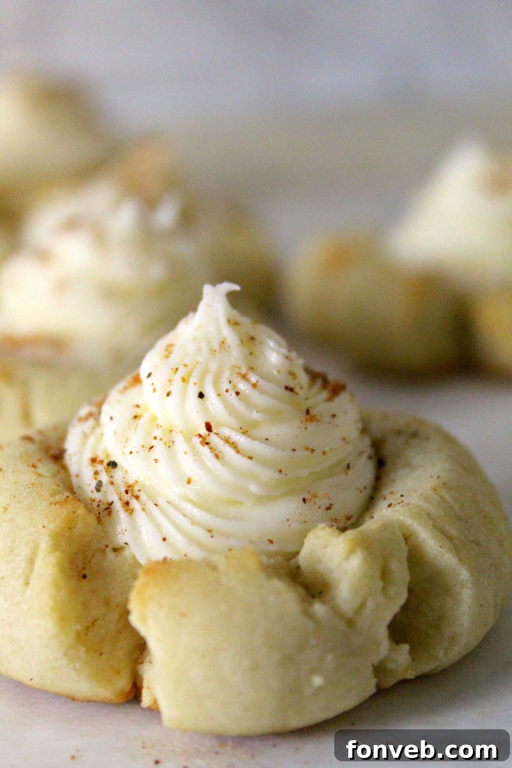 Ingredients for Eggnog Thumbprint Cookies laid out on a baking surface.