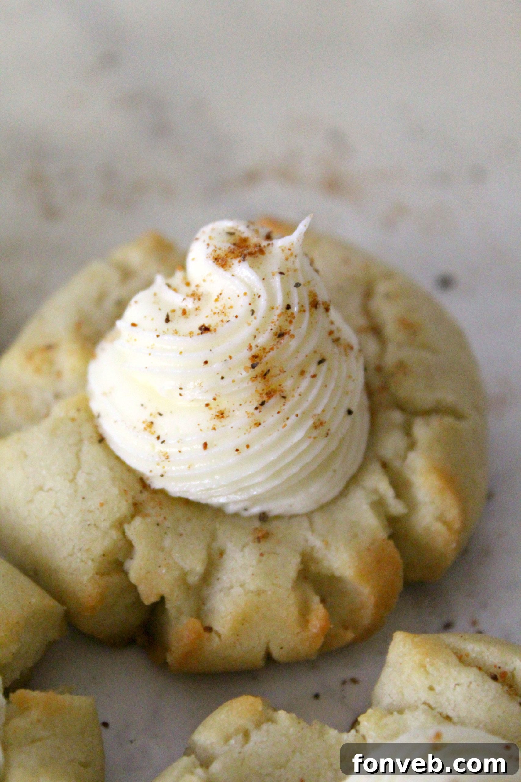 A festive holiday tray filled with a variety of cookies, including Eggnog Thumbprint Cookies.