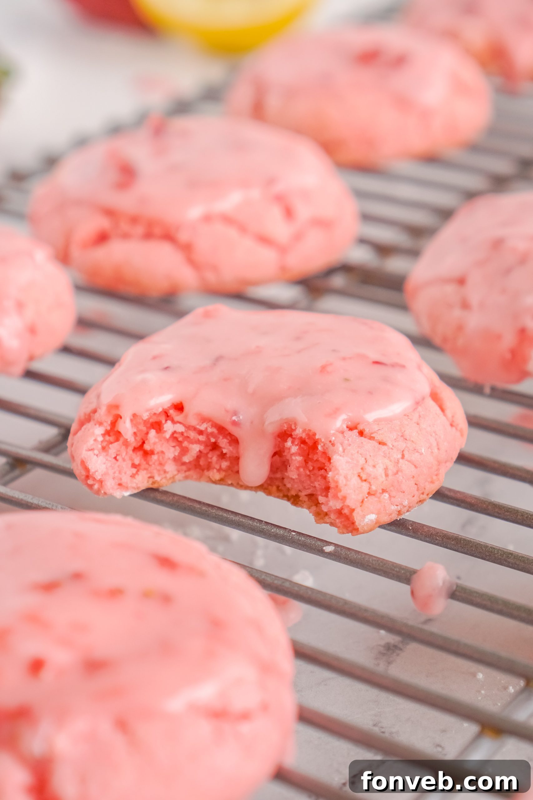 Platter of freshly baked and glazed strawberry cookies, ready to be enjoyed.