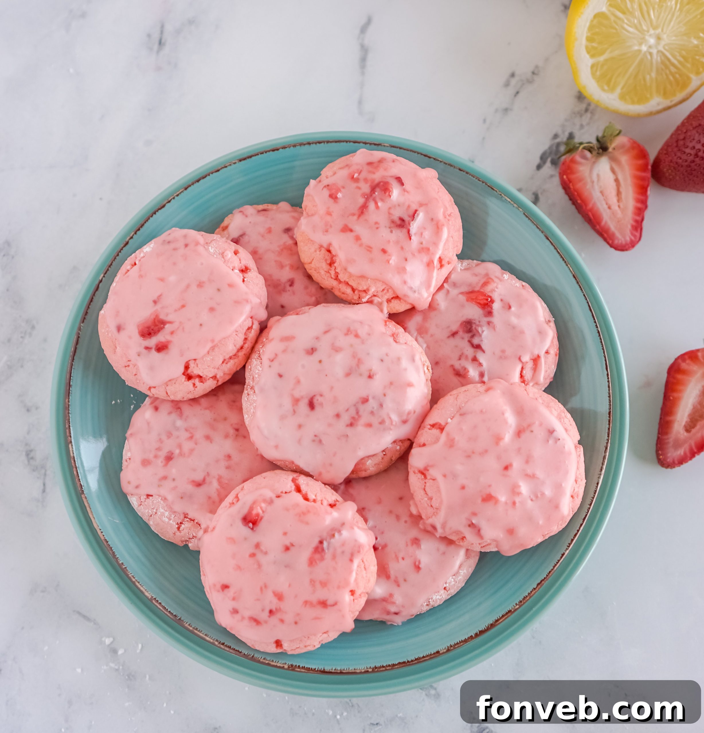 Close-up of cookie dough being mixed in a bowl for strawberry cake mix cookies.