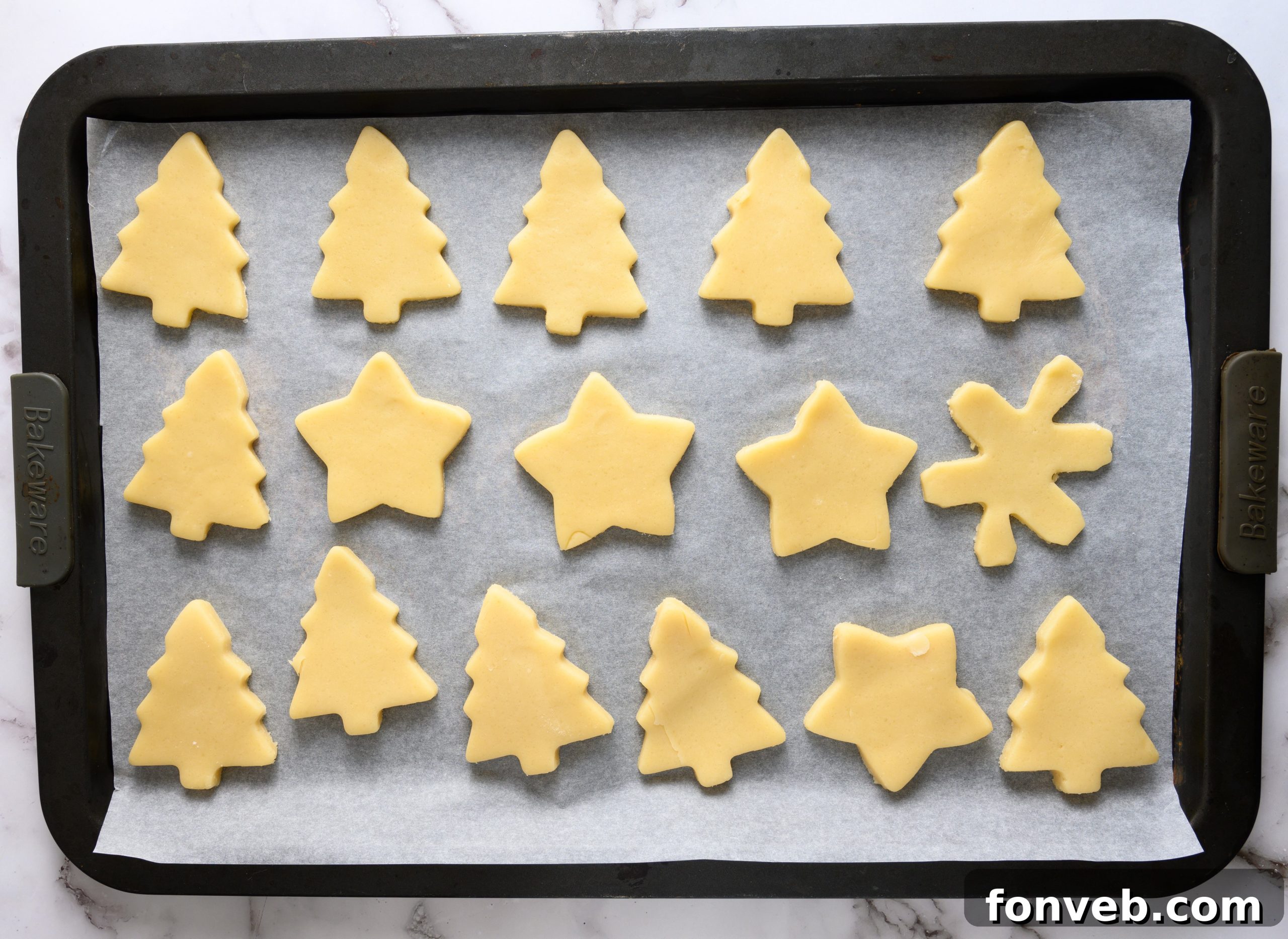 A selection of decorated sugar cookies in various festive shapes and colors.
