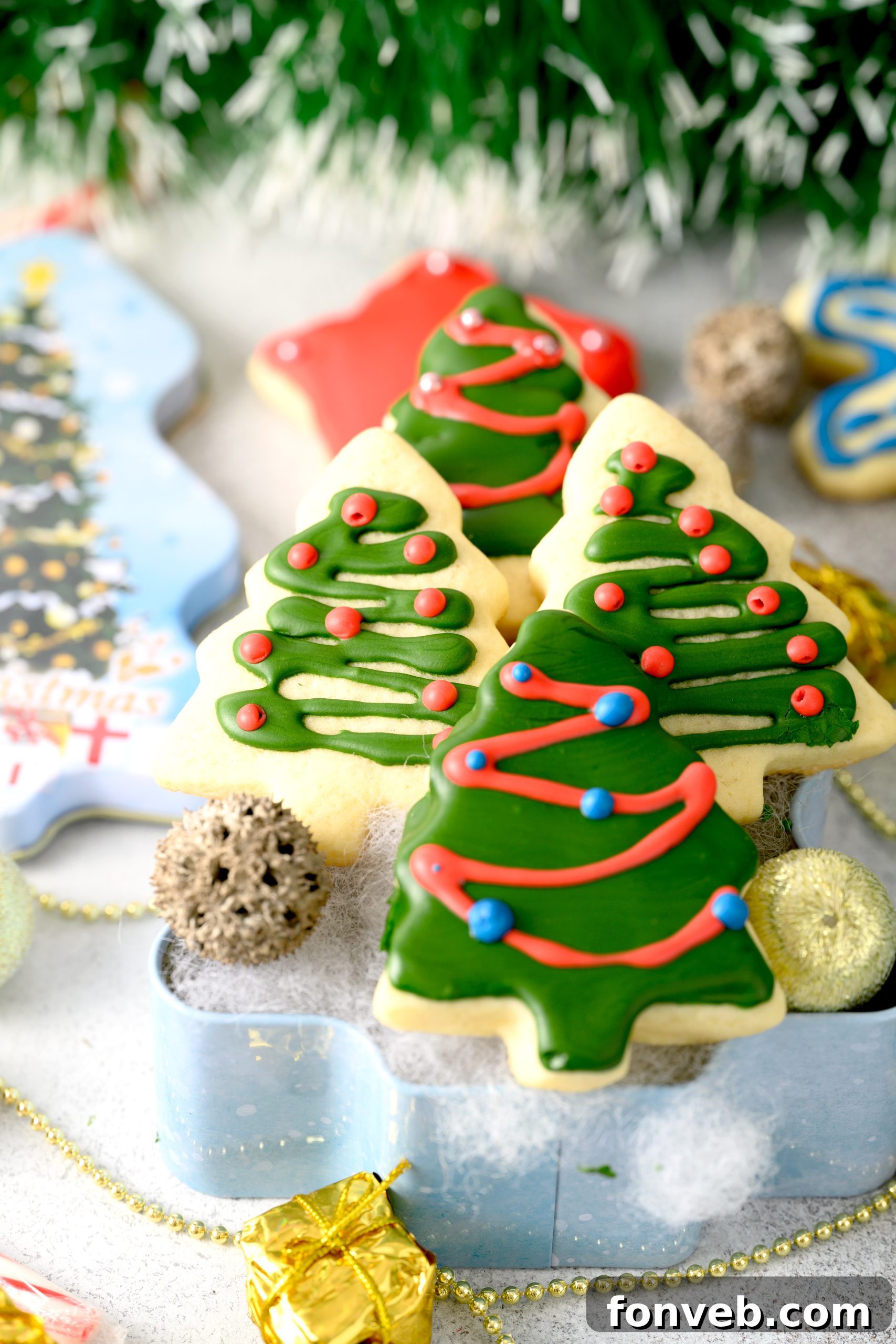 Close-up of the essential ingredients for sugar cookies laid out on a kitchen counter: butter, eggs, sugar, vanilla extract, flour, and baking powder.