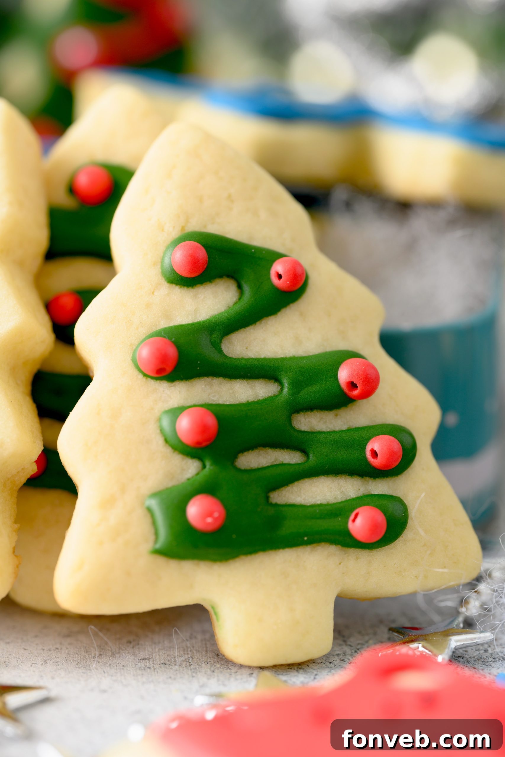 Freshly baked sugar cookies cooling on a wire rack, still warm and inviting.