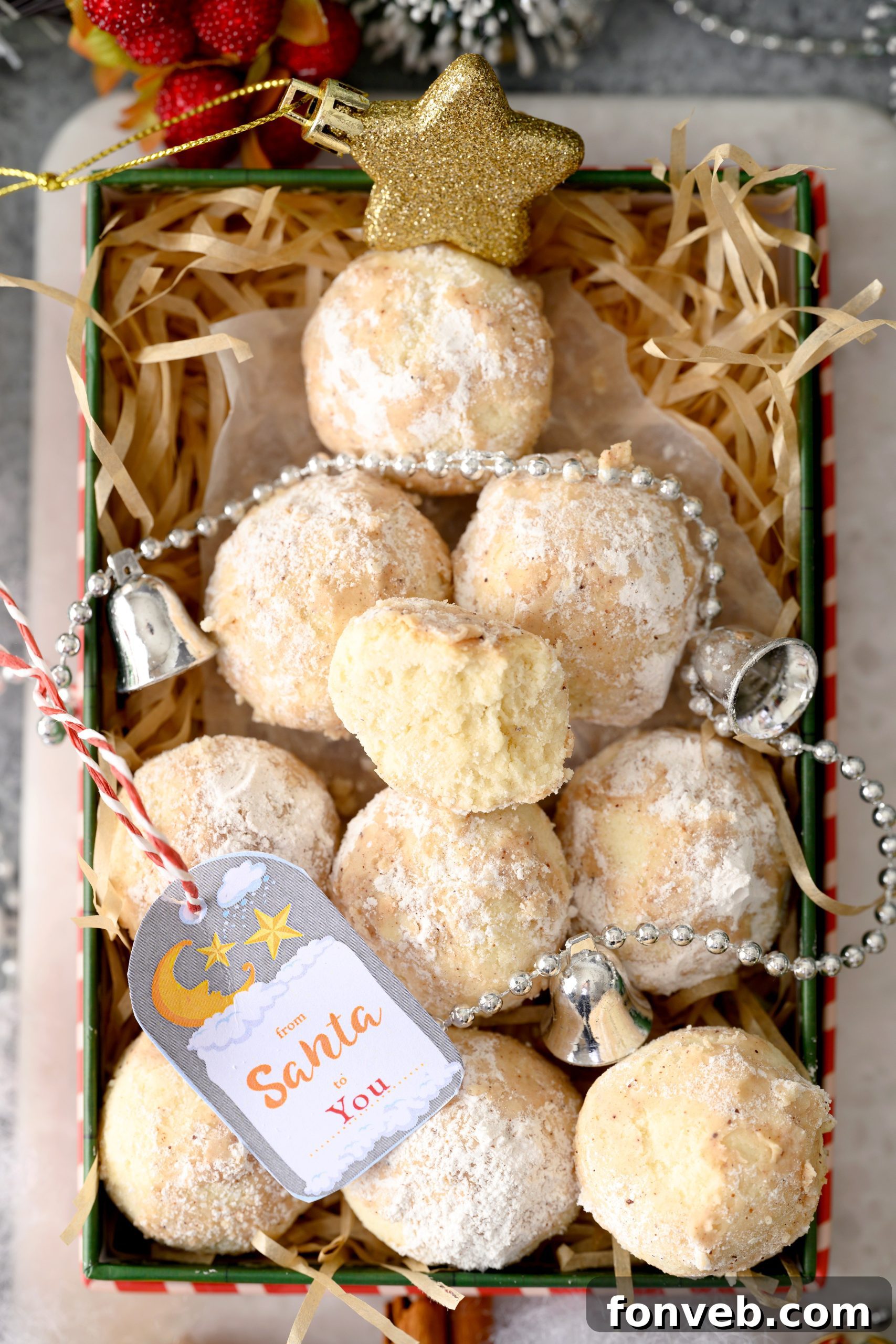 A large batch of Cinnamon Mexican Wedding Cookies on a white plate