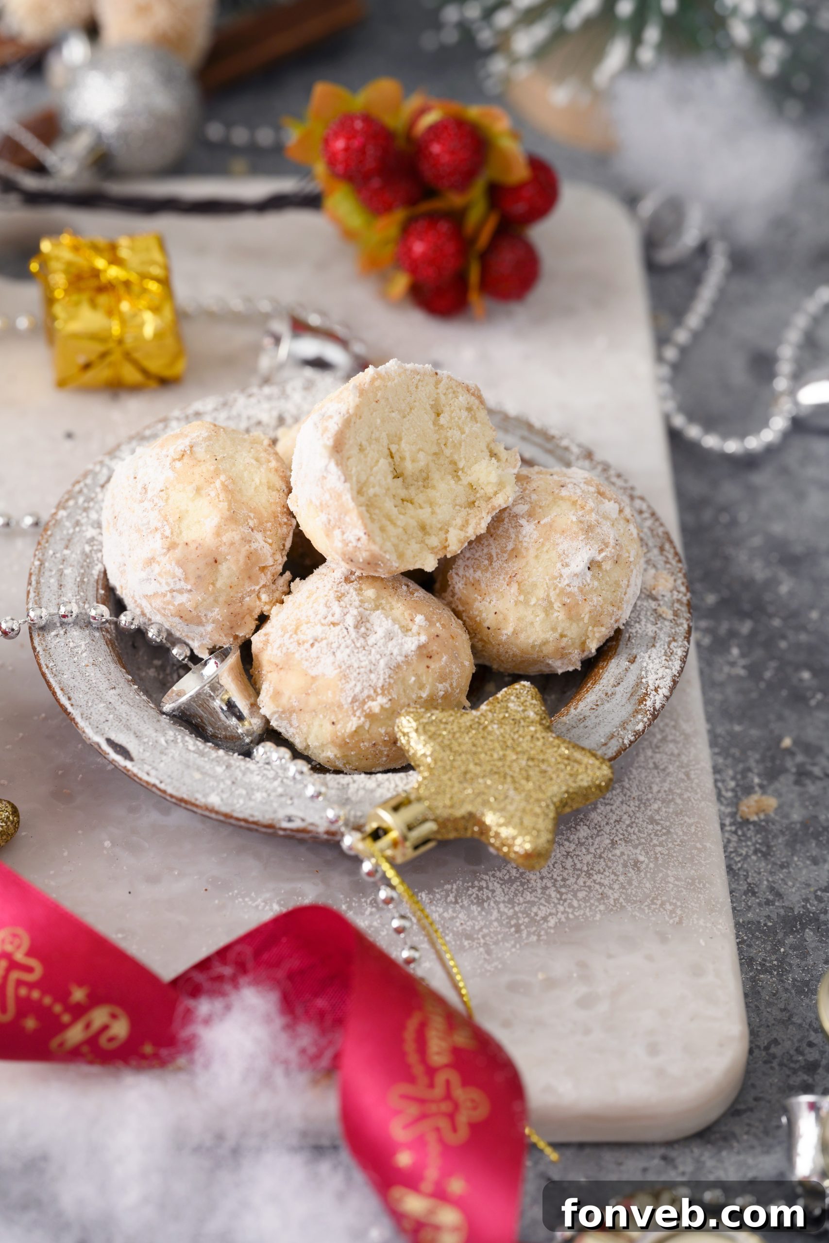Close-up of Cinnamon Mexican Wedding Cookies arranged on a plate
