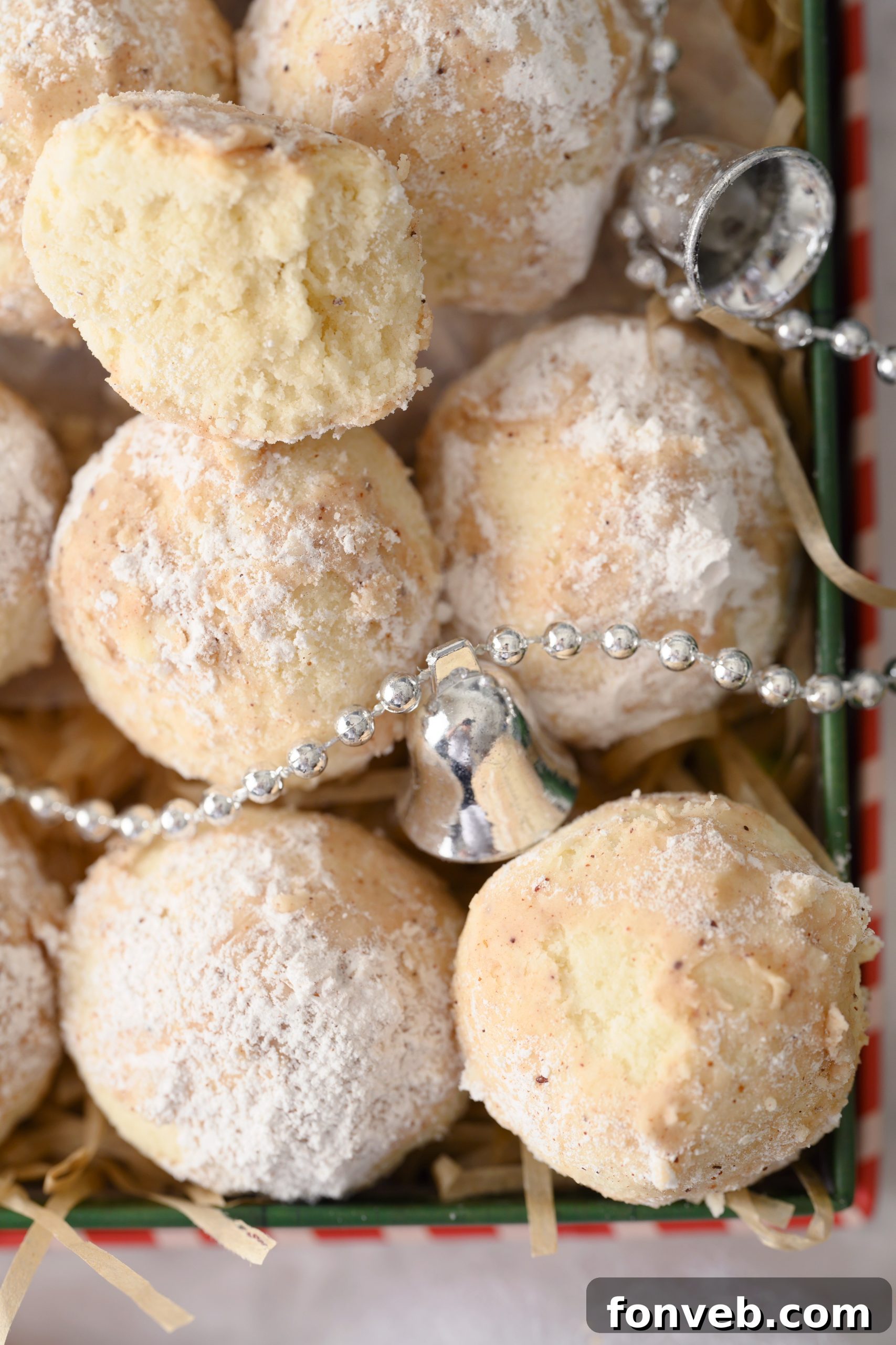 Several Cinnamon Mexican Wedding Cookies on a cooling rack