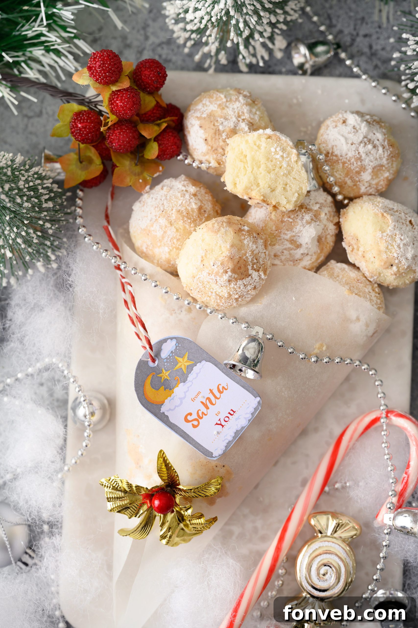 Cinnamon Mexican Wedding Cookies artfully arranged with a cookbook