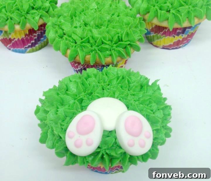 Individual Easter bunny butt cupcakes ready for serving, showcasing the vibrant green frosting.