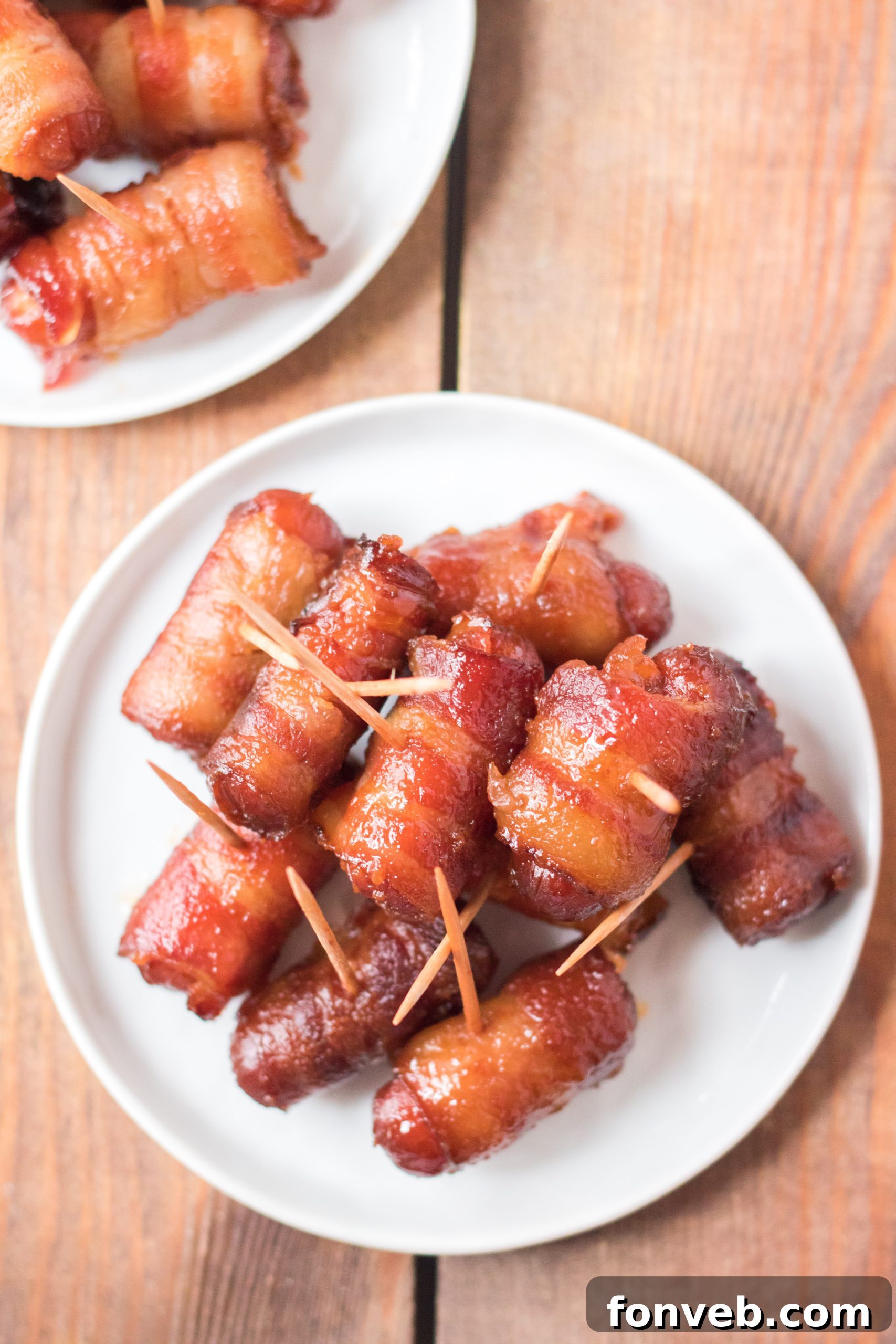 A festive holiday spread featuring Slow Cooker Bacon Wrapped Smokies as a centerpiece.