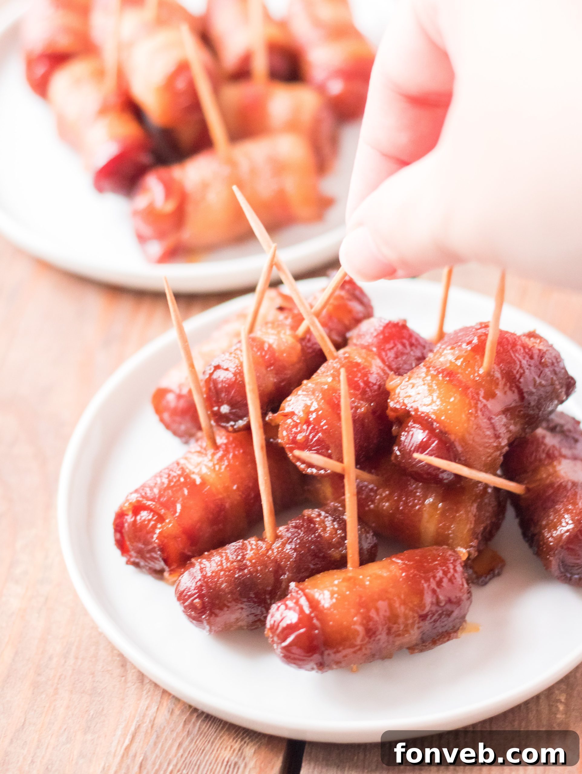 A family enjoying Slow Cooker Bacon Wrapped Smokies during a casual get-together.