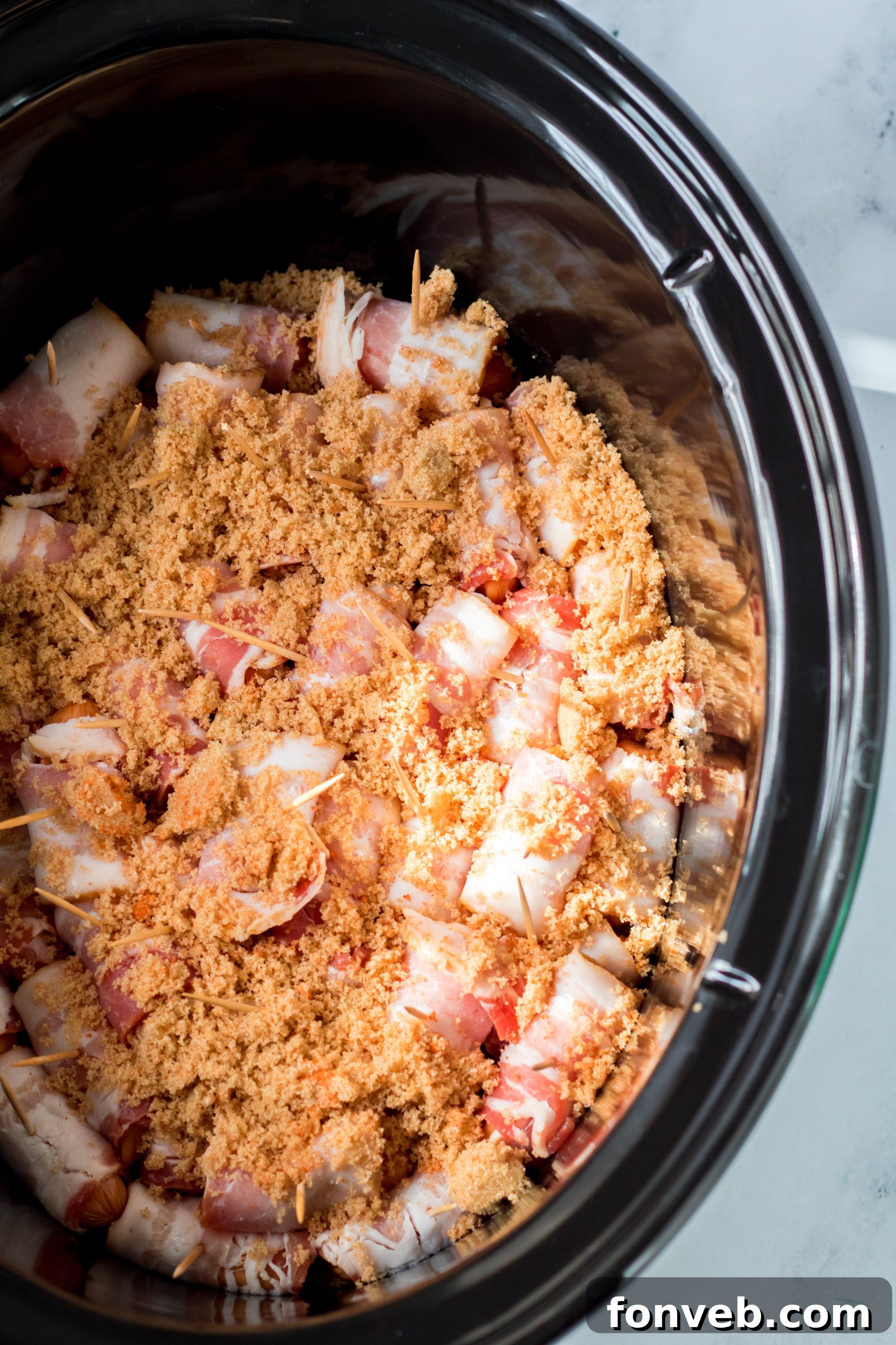 An inviting platter of Slow Cooker Bacon Wrapped Smokies, showcasing the candied bacon effect.